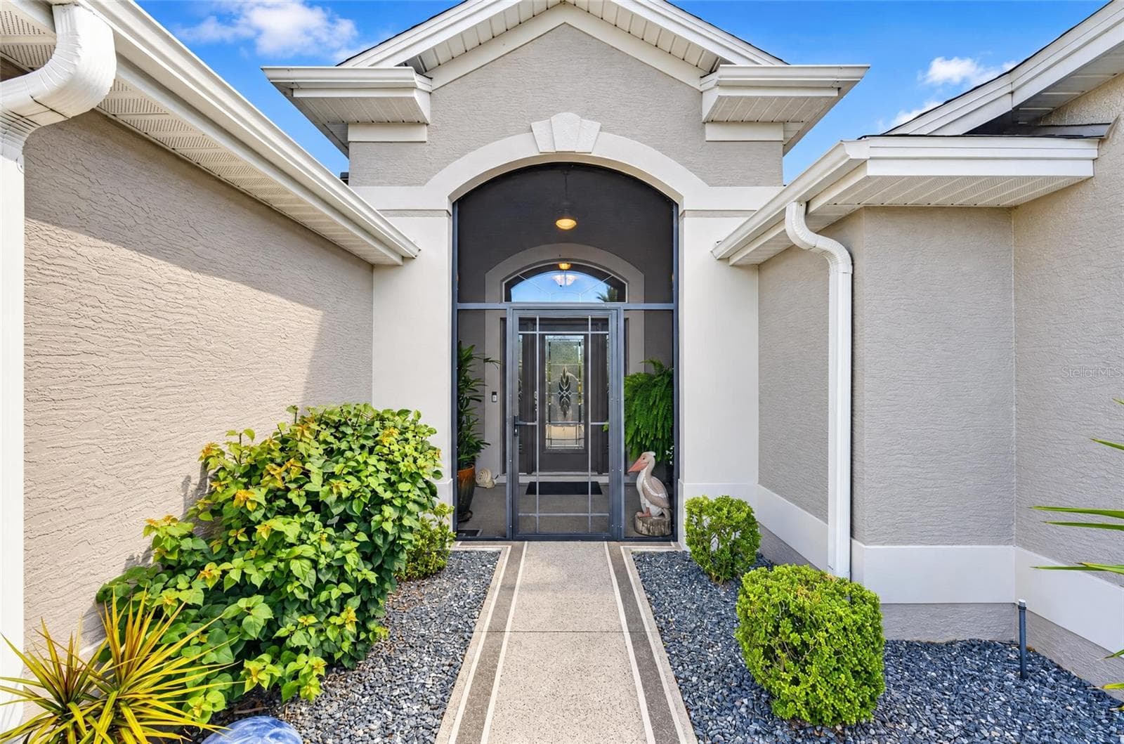 Entrancek with painted walkway and screened in front porch. - 3665 VALLEYBROOK WAY, THE VILLAGES