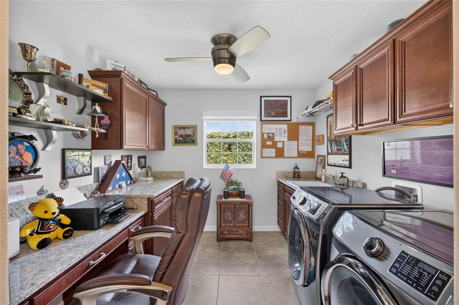 Laundry with sink, cabinets and built-in desk. - 3665 VALLEYBROOK WAY, THE VILLAGES
