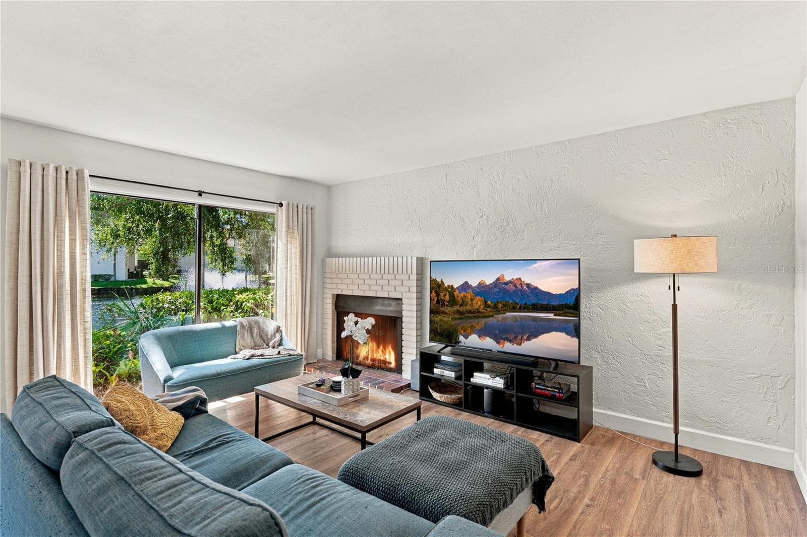 Charming Living Room Area with Beautiful Wood Burning Fireplace - 4106 PINELAKE LN #101, TAMPA