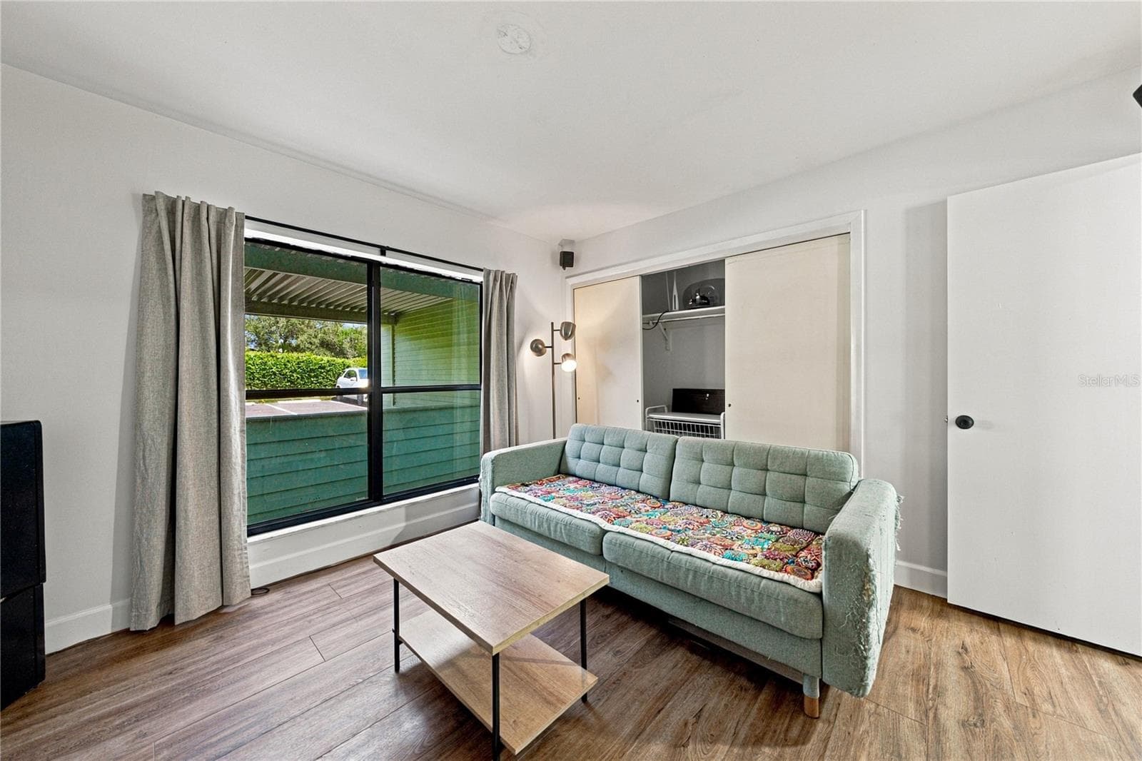 Second Bedroom used as a Movie Room with Plank Flooring and Large Closet - 4106 PINELAKE LN #101, TAMPA