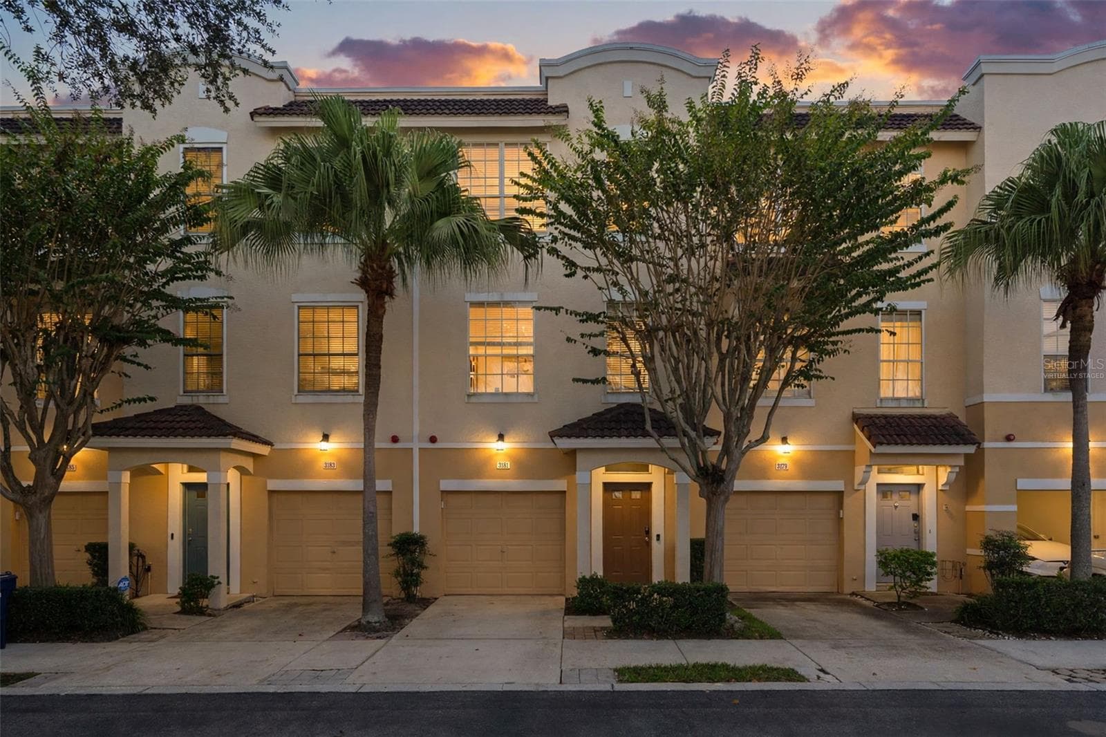 Front exterior - virtually staged twilight (digitally altered sky and lighting) - 3181 BAYSHORE OAKS DR, TAMPA