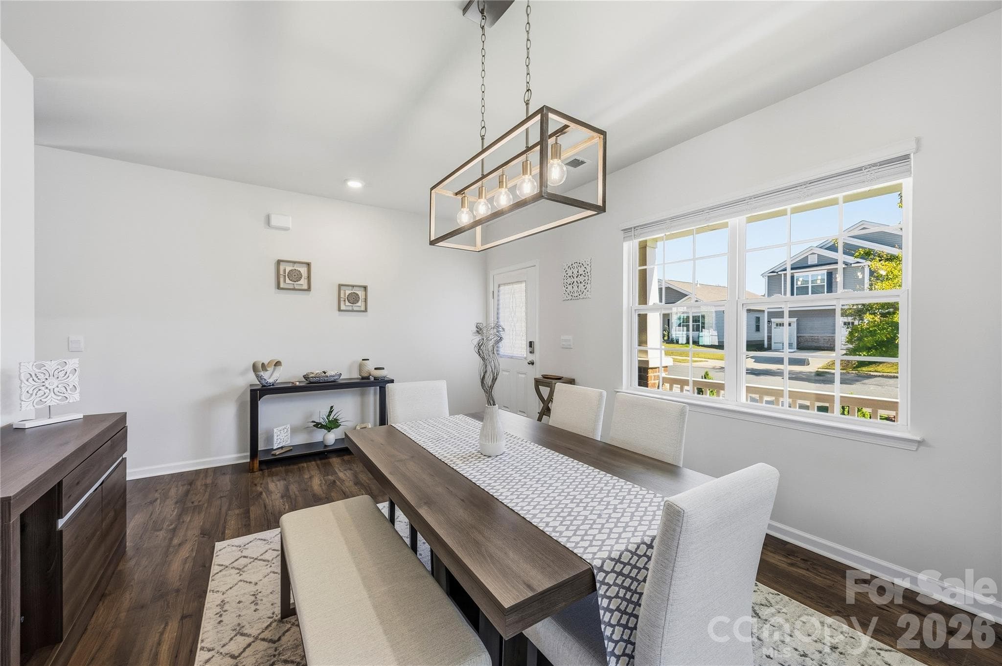 Formal Dining with designer light fixtures and Entry Way. - 9022 Poquoson Drive, Gastonia
