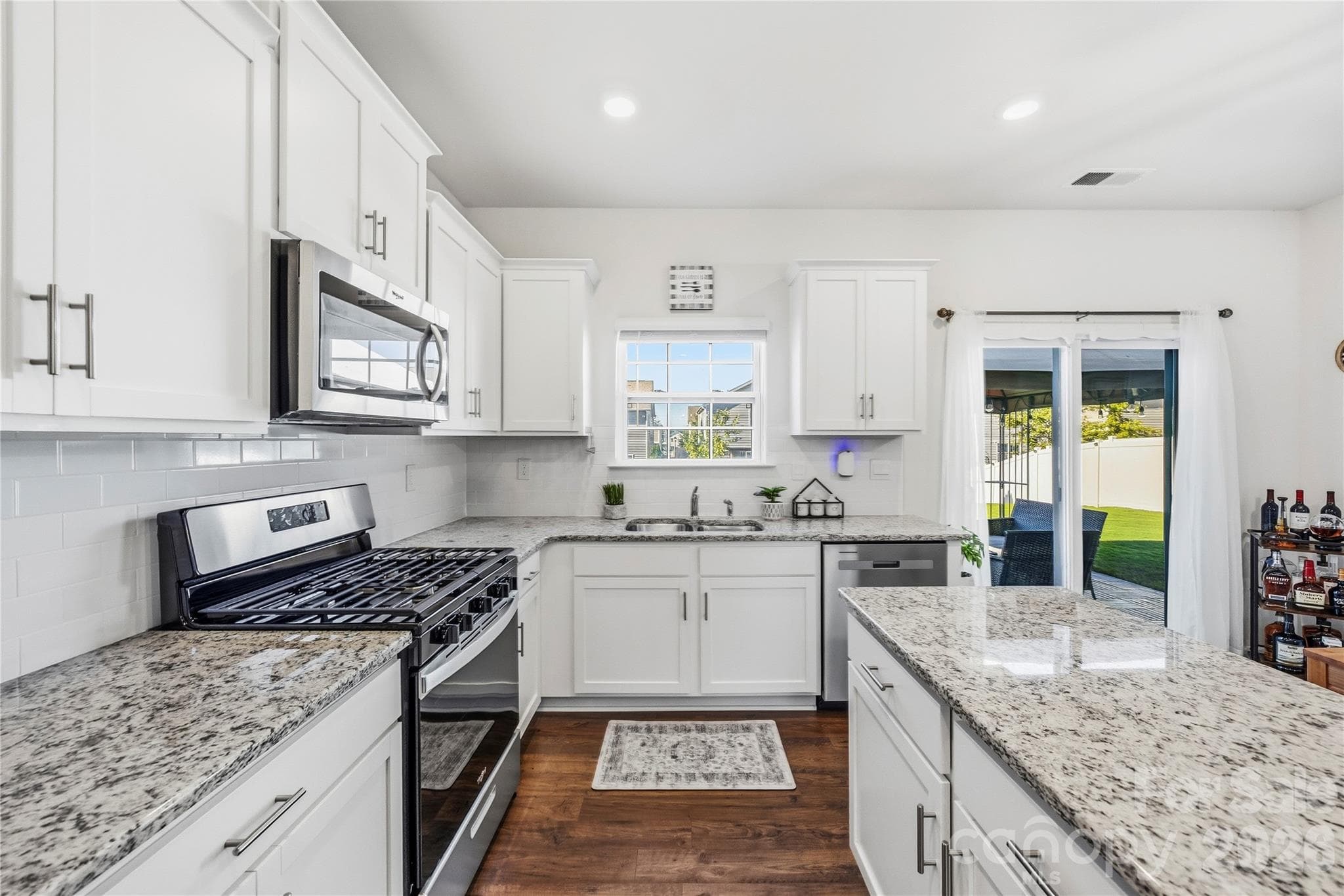 Open floor plan with plenty of counter space and storage. - 9022 Poquoson Drive, Gastonia