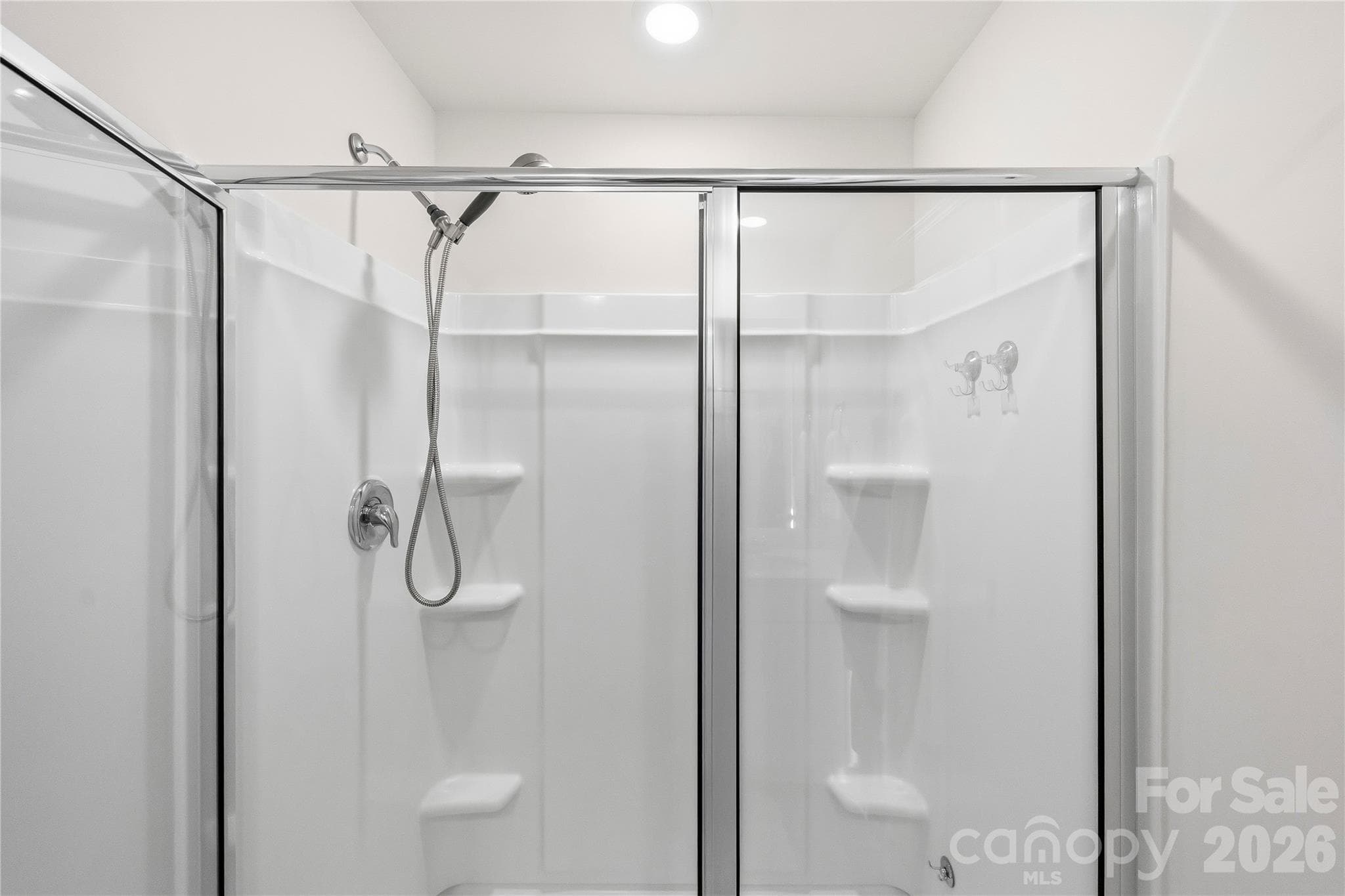 Primary bedroom walk- in shower. - 9022 Poquoson Drive, Gastonia