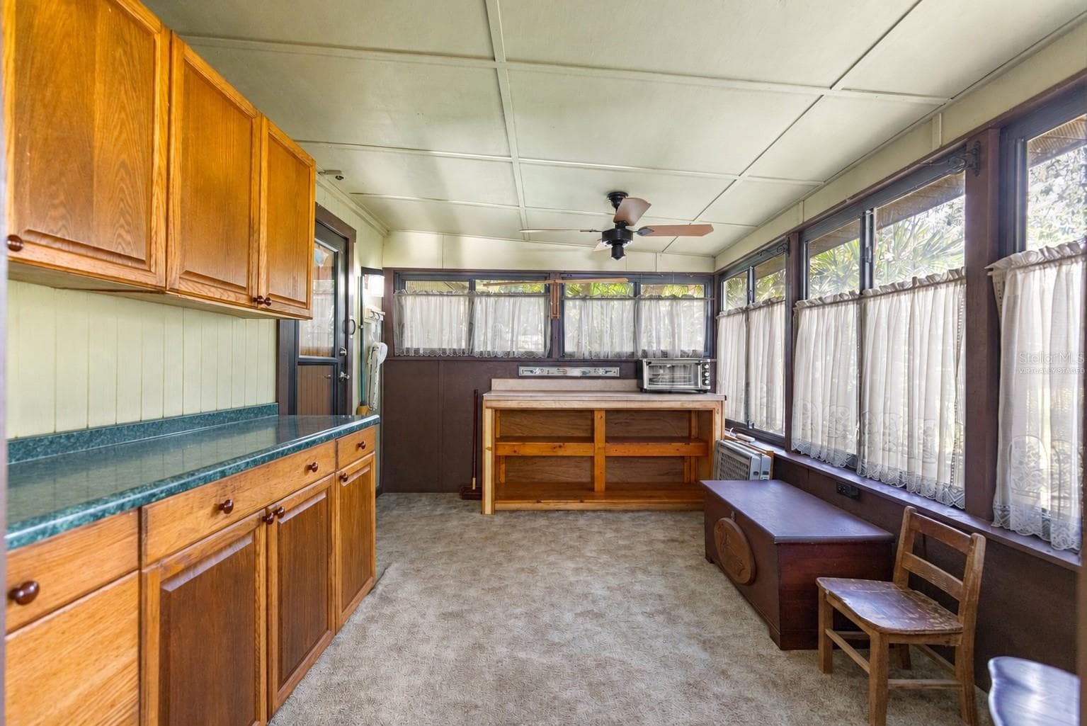 #1 · Enclosed back porch attached to the main residence. Virtually staged—personal items digitally removed. - 7434 E CABIN LN, INVERNESS