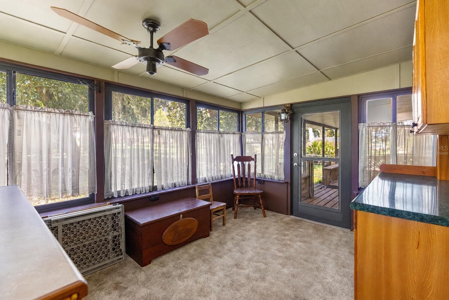 #1 · Enclosed back porch attached to the main residence, reverse view. Virtually staged—personal items digitally removed. - 7434 E CABIN LN, INVERNESS
