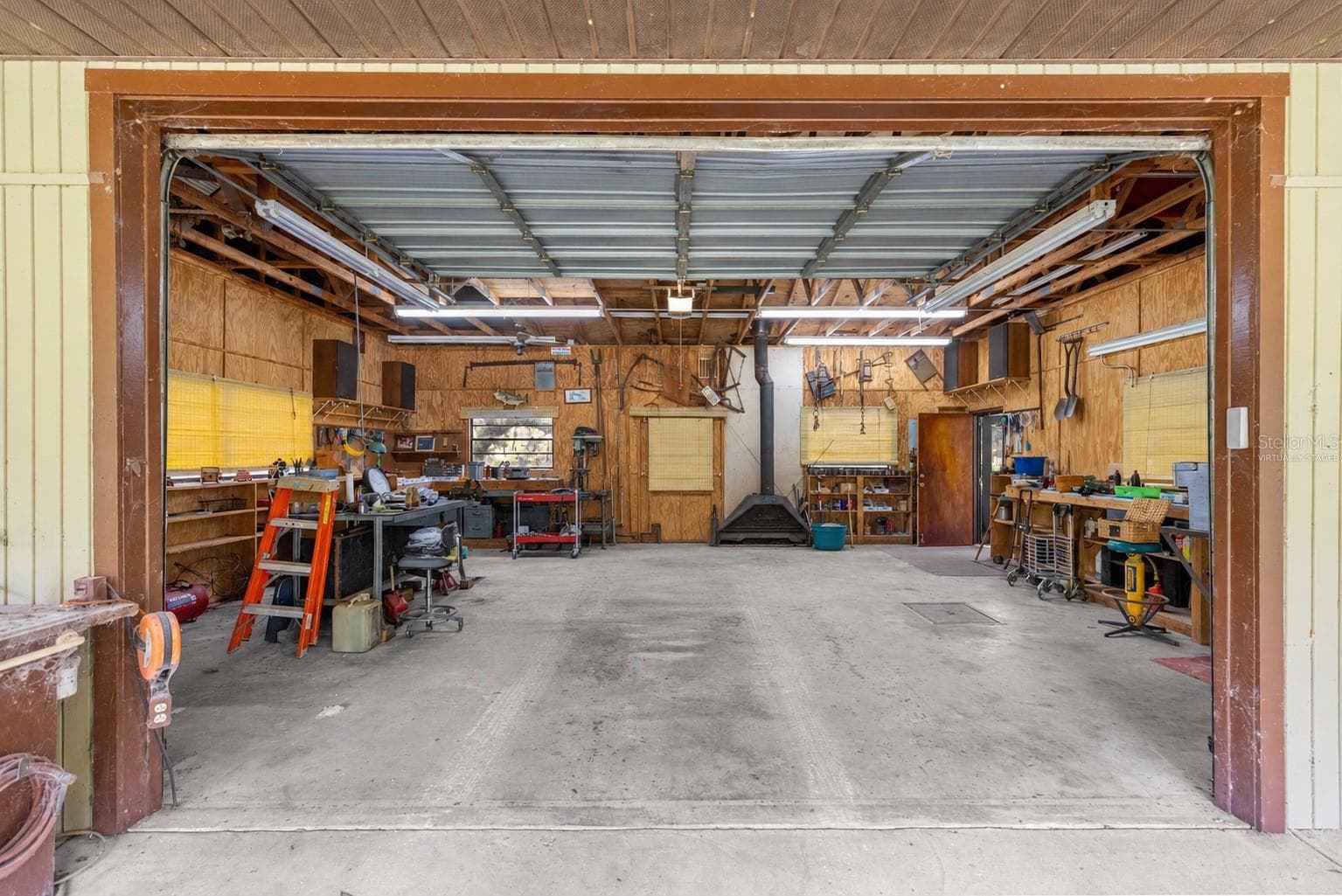 #2 · Mechanic’s shop interior. Virtually staged—personal items digitally removed. - 7434 E CABIN LN, INVERNESS