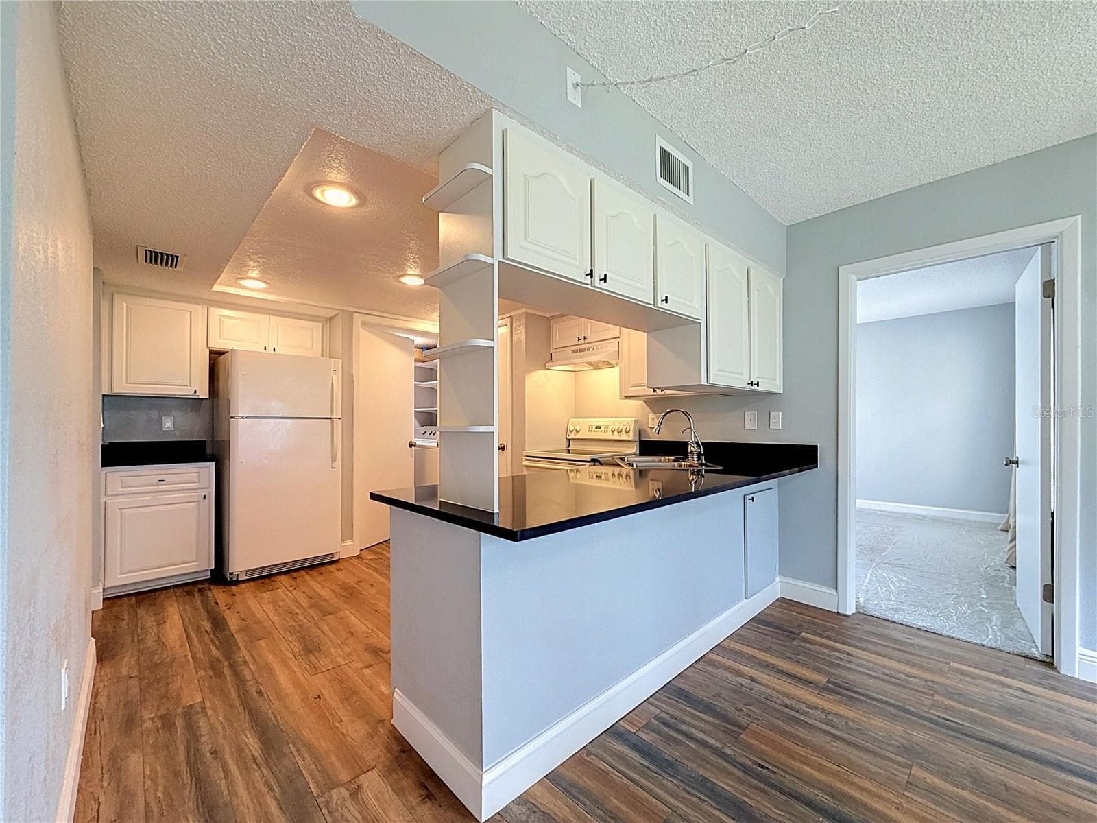 Kitchen view from dinning room - 225 COUNTRY CLUB DR #E252, LARGO