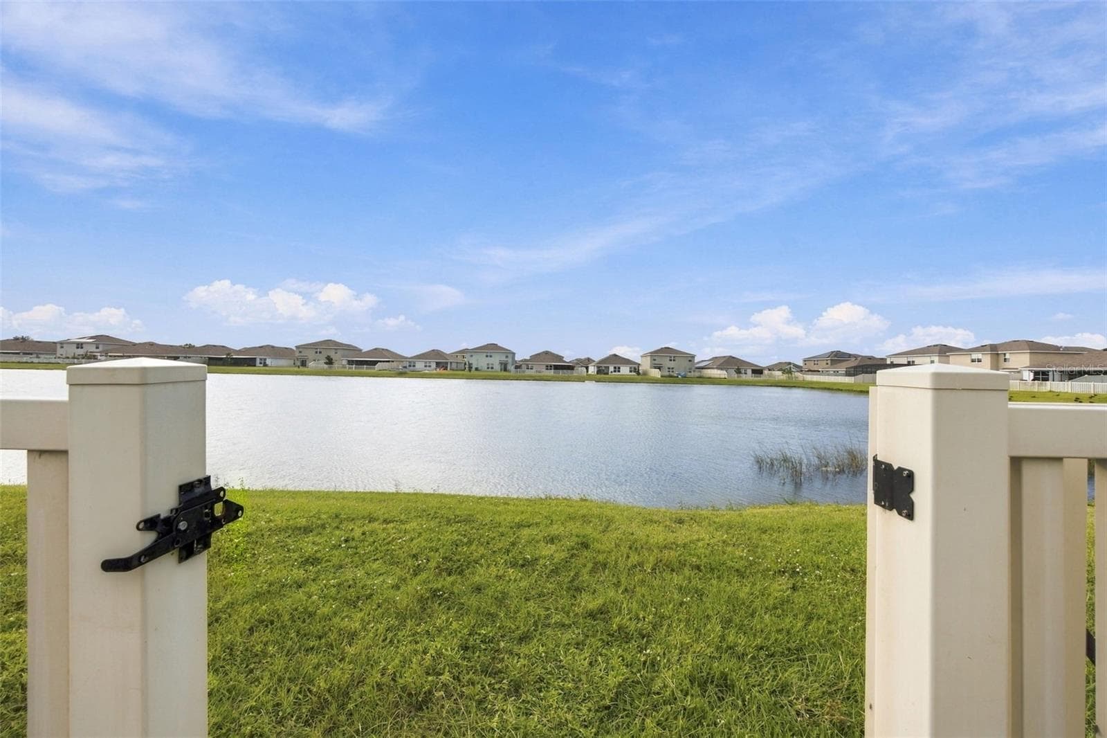 Pond view from backyard - 16739 SUNBURST LAKE ST, WIMAUMA