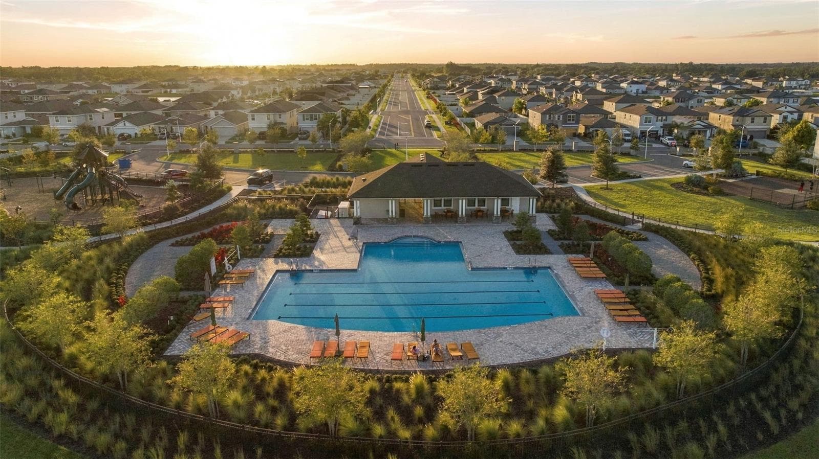 Clubhouse and pool view - 16739 SUNBURST LAKE ST, WIMAUMA