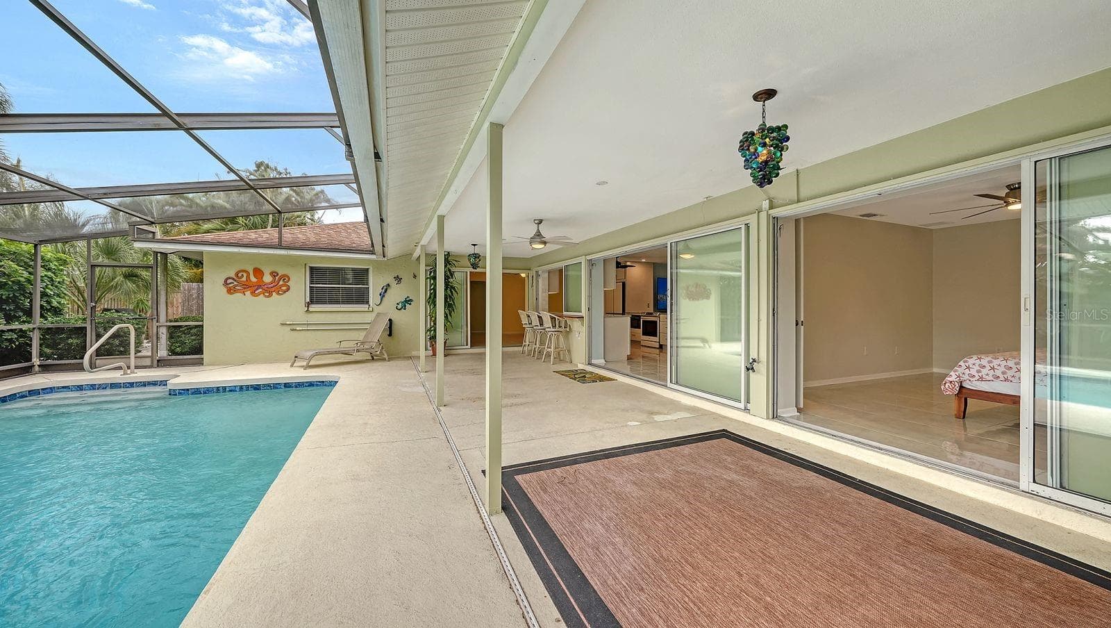 3 sets of sliders to the Lanai & Pool Area. - 2295 PINE VIEW CIR, SARASOTA