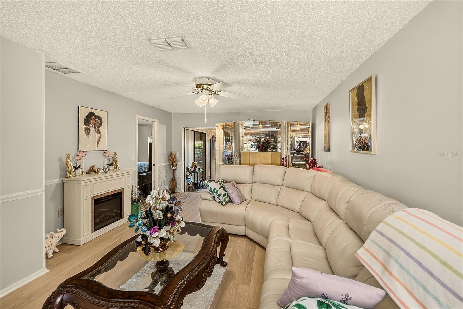 View of living room with fireplace - 19029 US HIGHWAY 19 N #21F, CLEARWATER