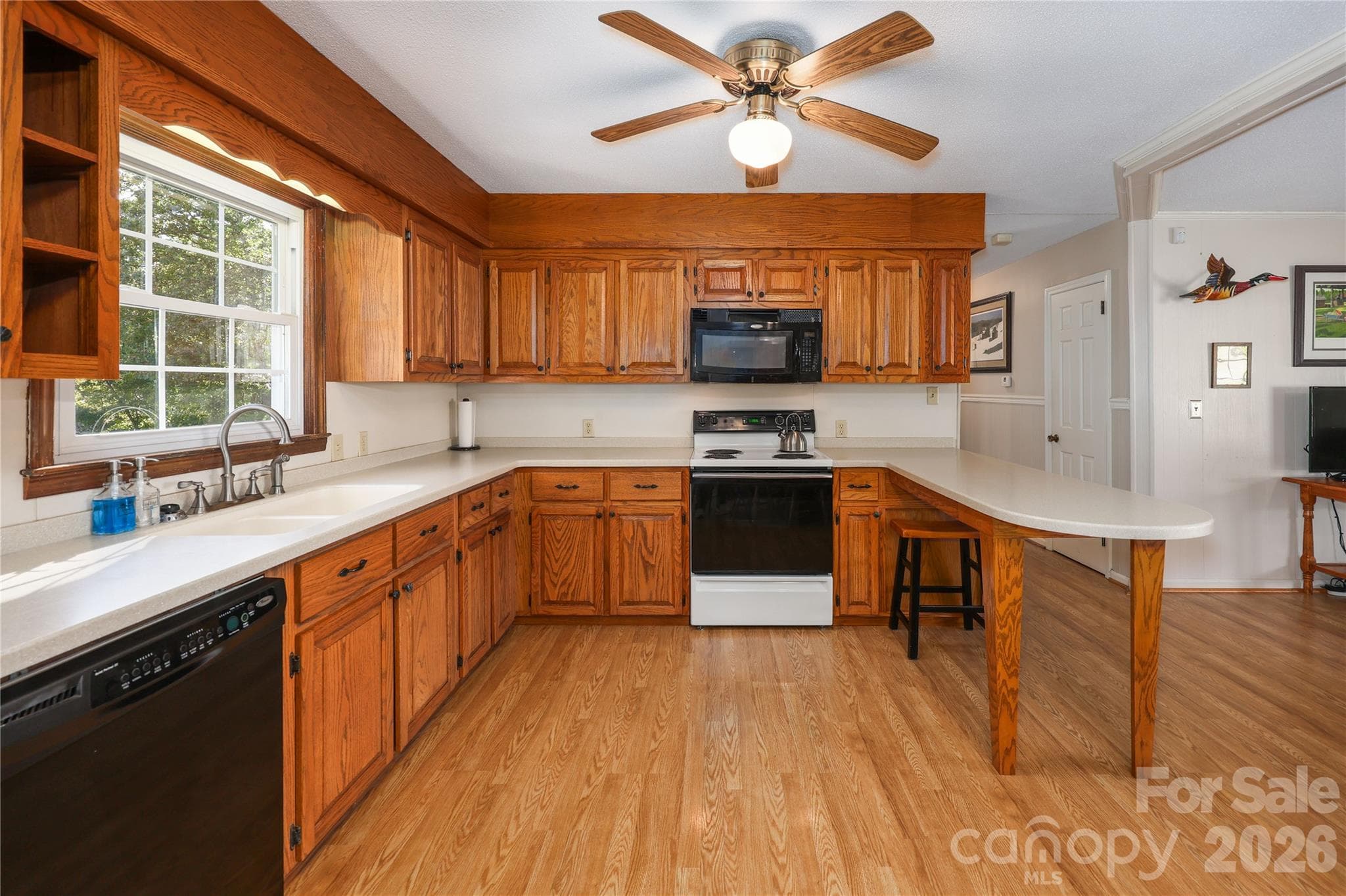 Kitchen with dishwasher and attached microwave - 149 Seeley Drive, Denton