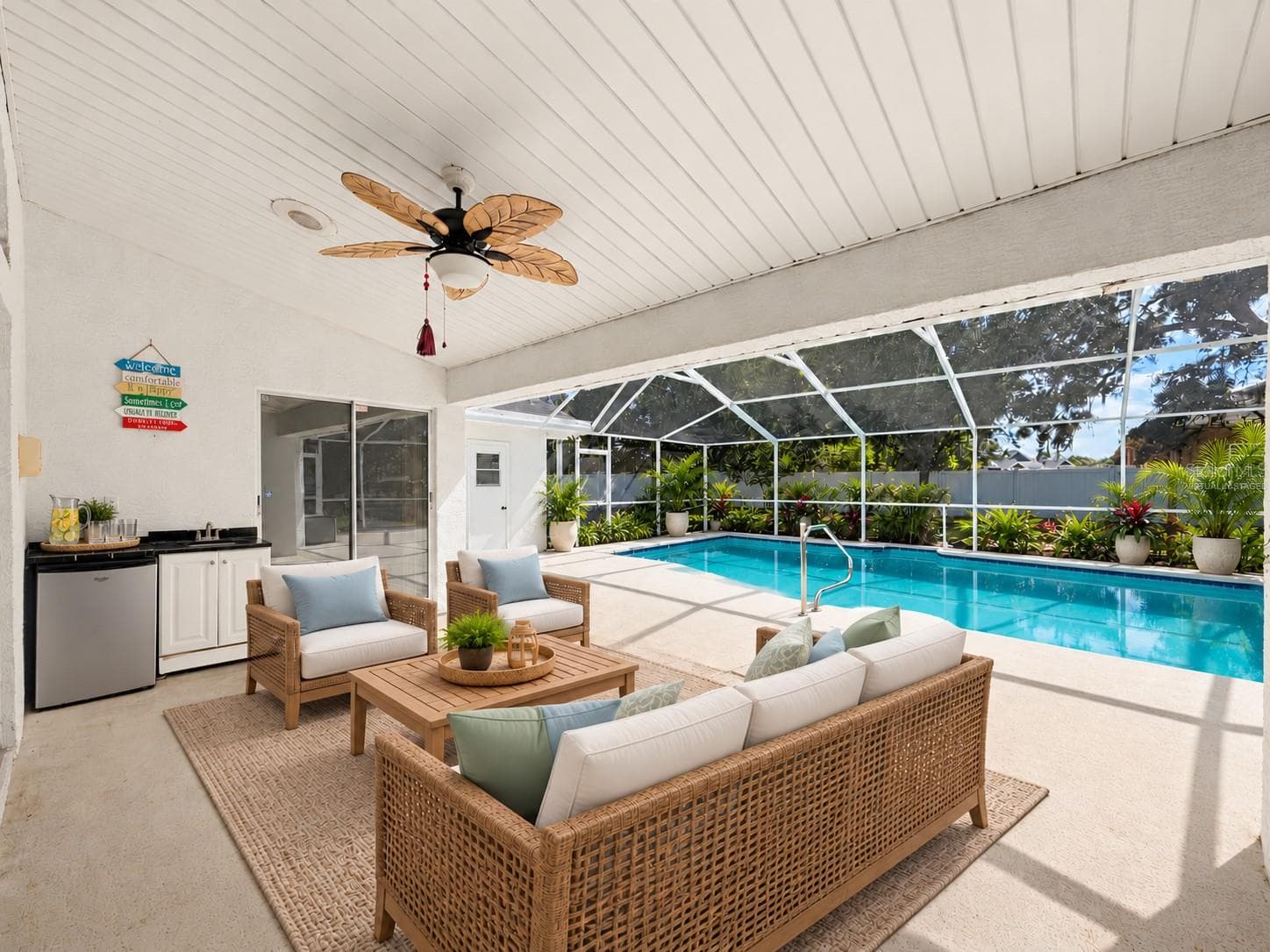 Large covered patio with minifridge and sink. (virtually staged) - 10074 SLEEPY WILLOW CT, SPRING HILL