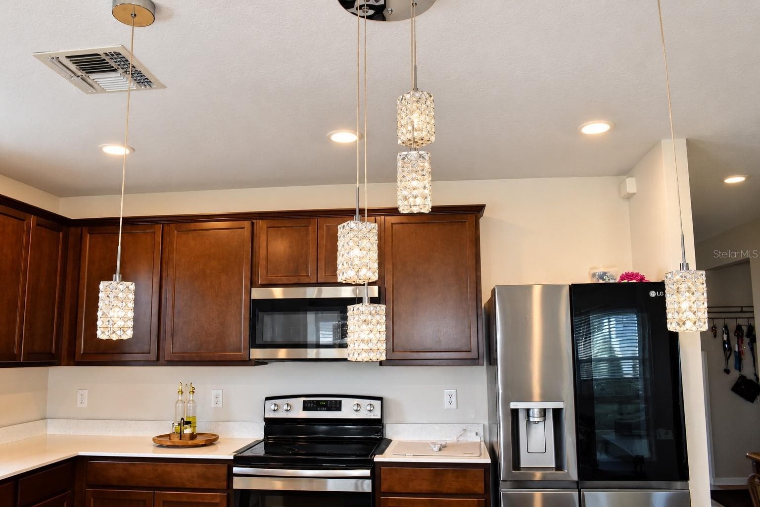 Beautiful Kitchen with Elegant Pendant Lighting - 30390 CARAVELLE LN, WESLEY CHAPEL