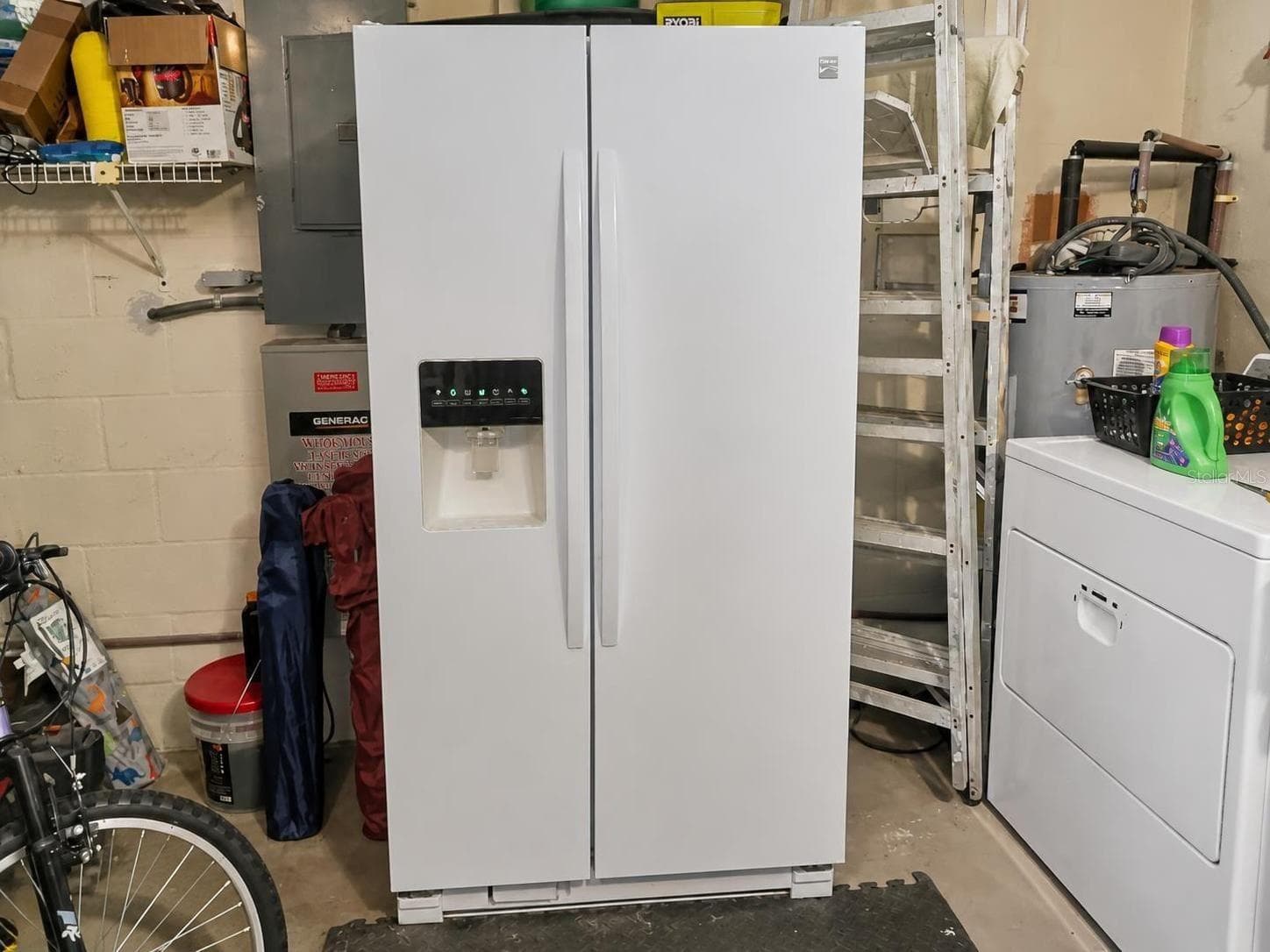 Fridge in the garage - 2074 W HIBISCUS RD, AVON PARK