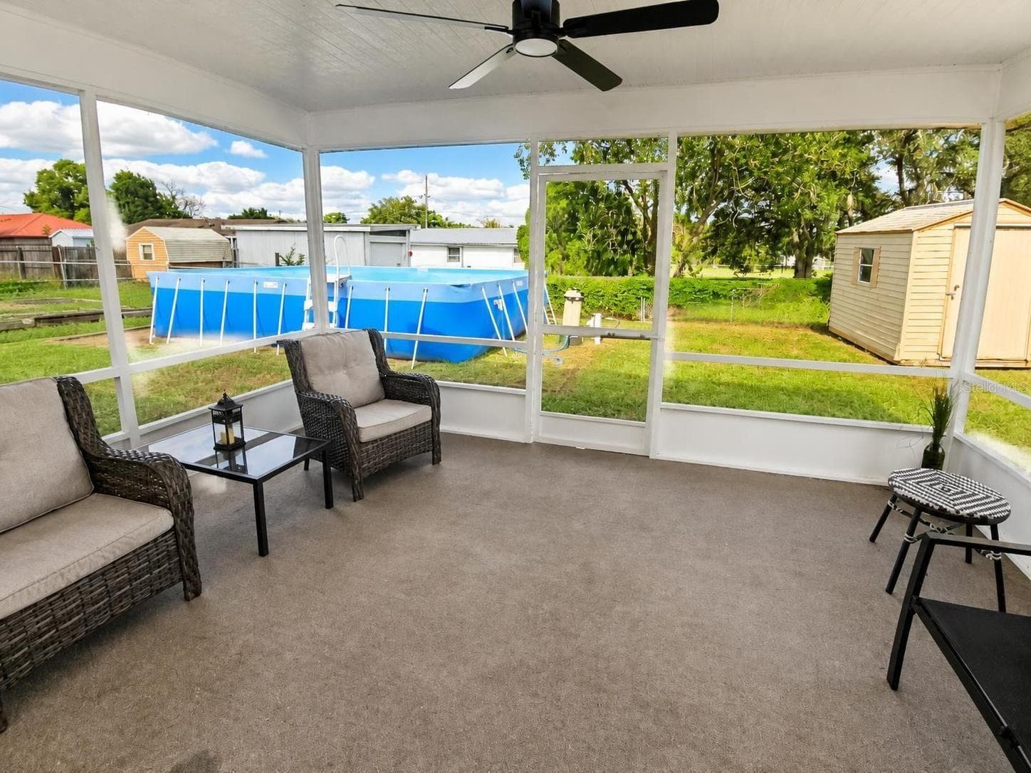 Lanai Just rescreened with a new fan - 2074 W HIBISCUS RD, AVON PARK
