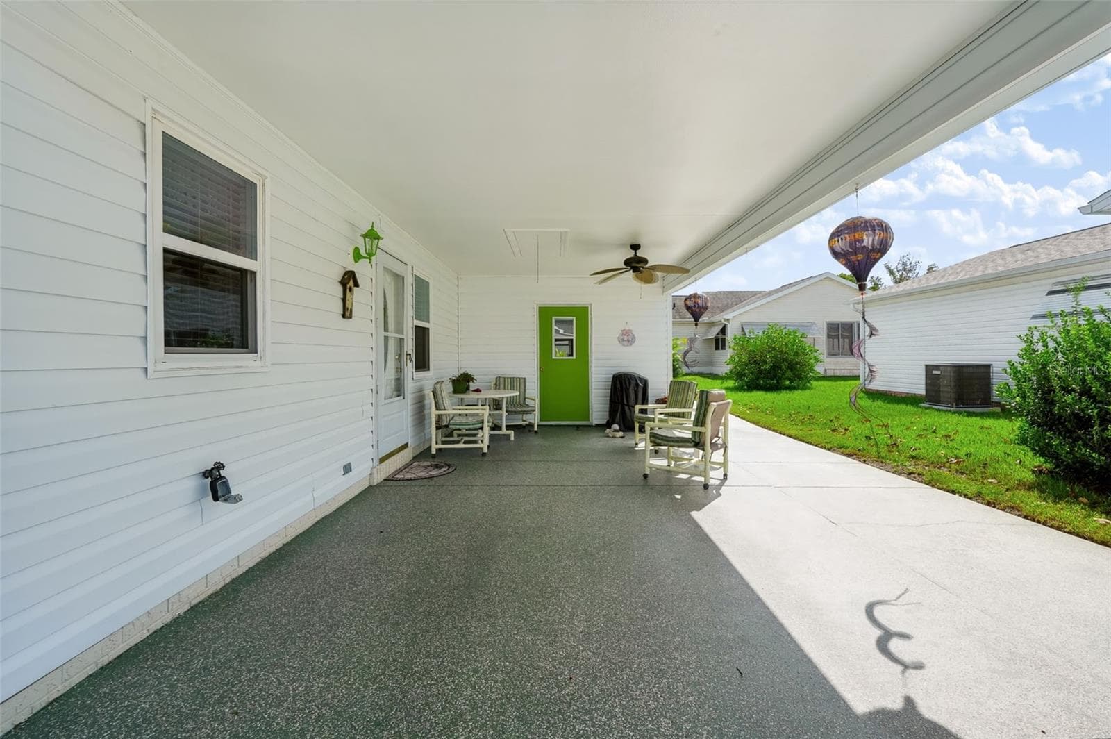Covered parking and patio - 1220 MARIA CT, LADY LAKE