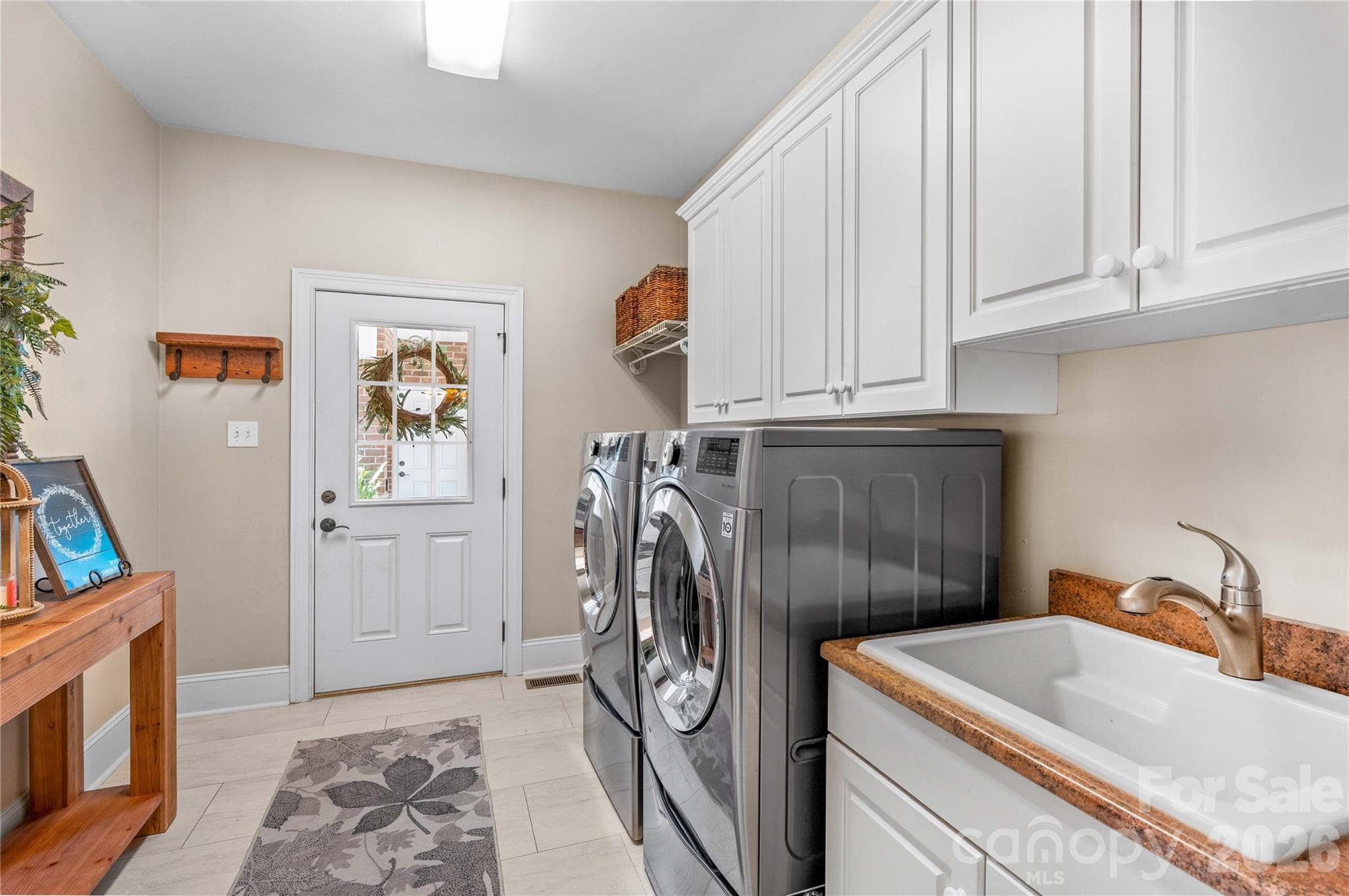 Main level laundry/mud room - 220 Cedar Lake Drive, Statesville
