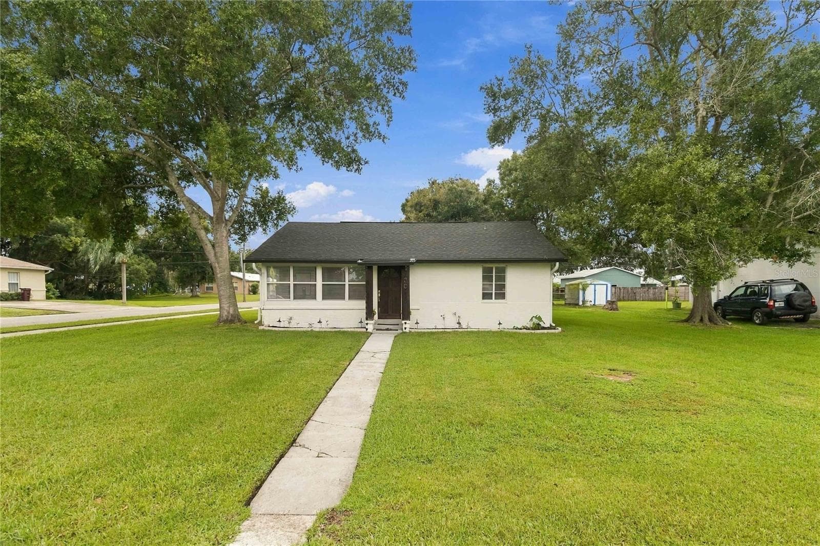 This charming home sits on a shaded, corner lot. - 438 VIRGINIA AVE, ST CLOUD