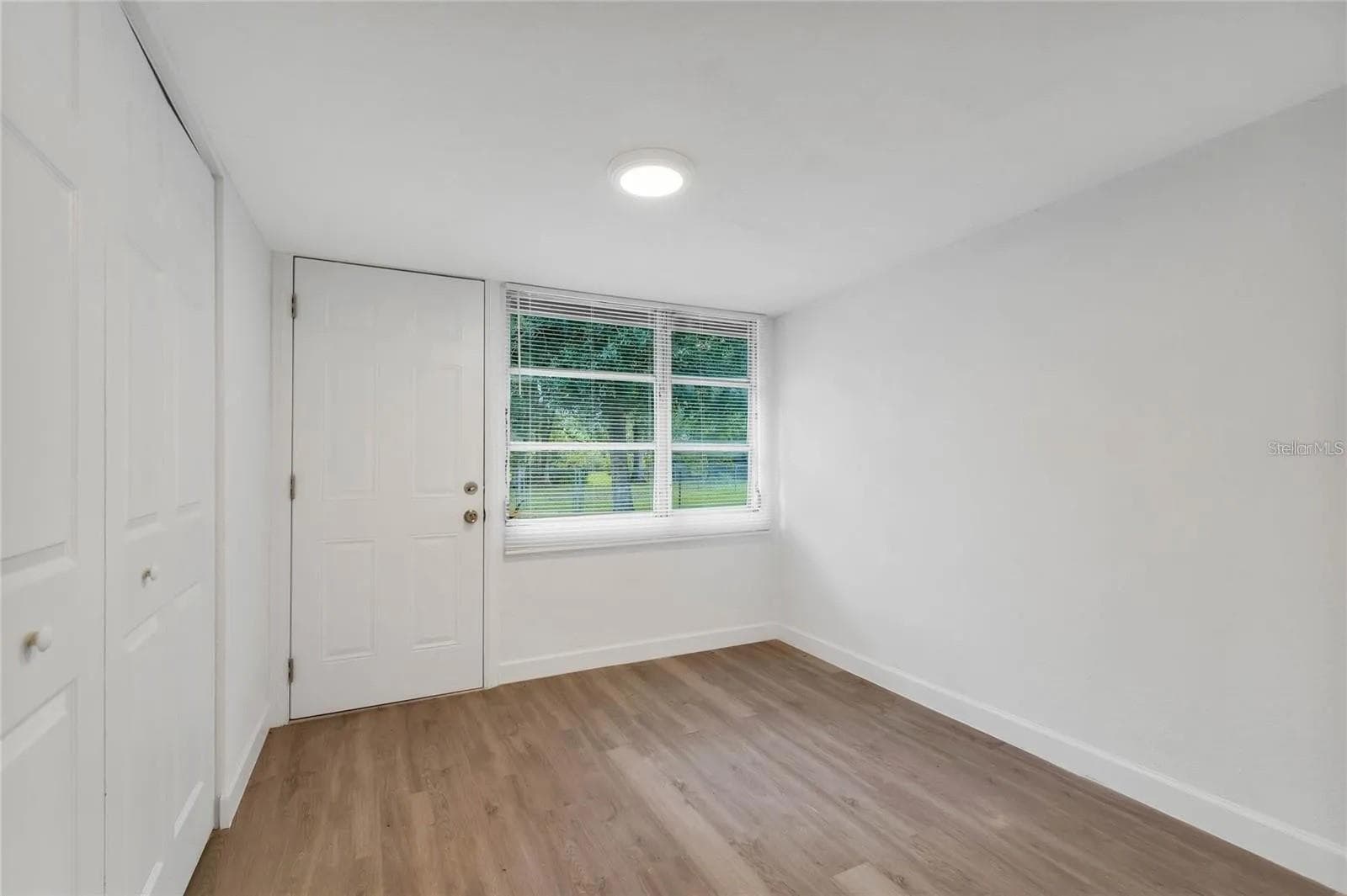 Bonus room with washer and dryer in the large closet. - 438 VIRGINIA AVE, ST CLOUD