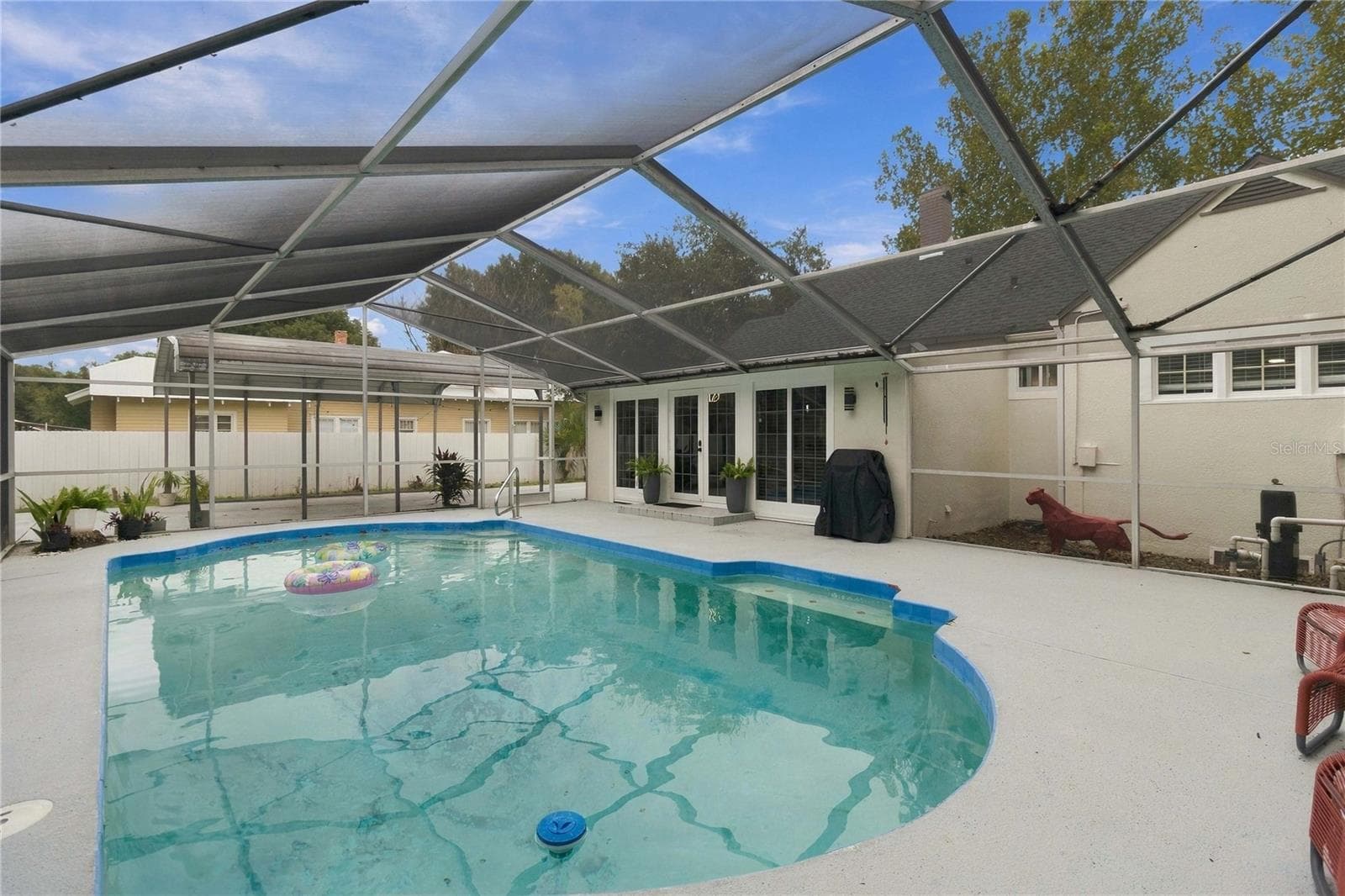 Screened pool with French doors leading inside - 430 FLORIDA AVE, ST CLOUD