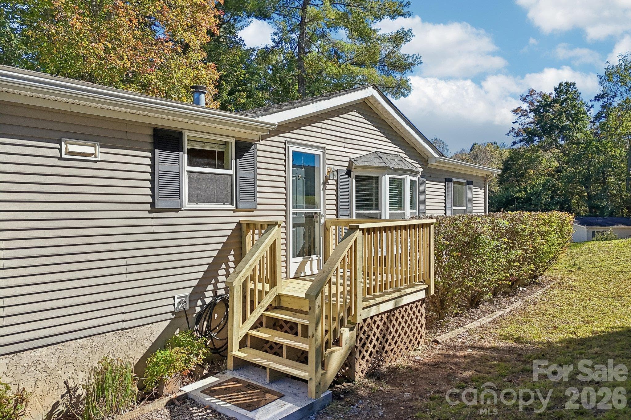this charming home offers privacy and comfort while being easy on the budget. - 202 Banyan Road, Candler