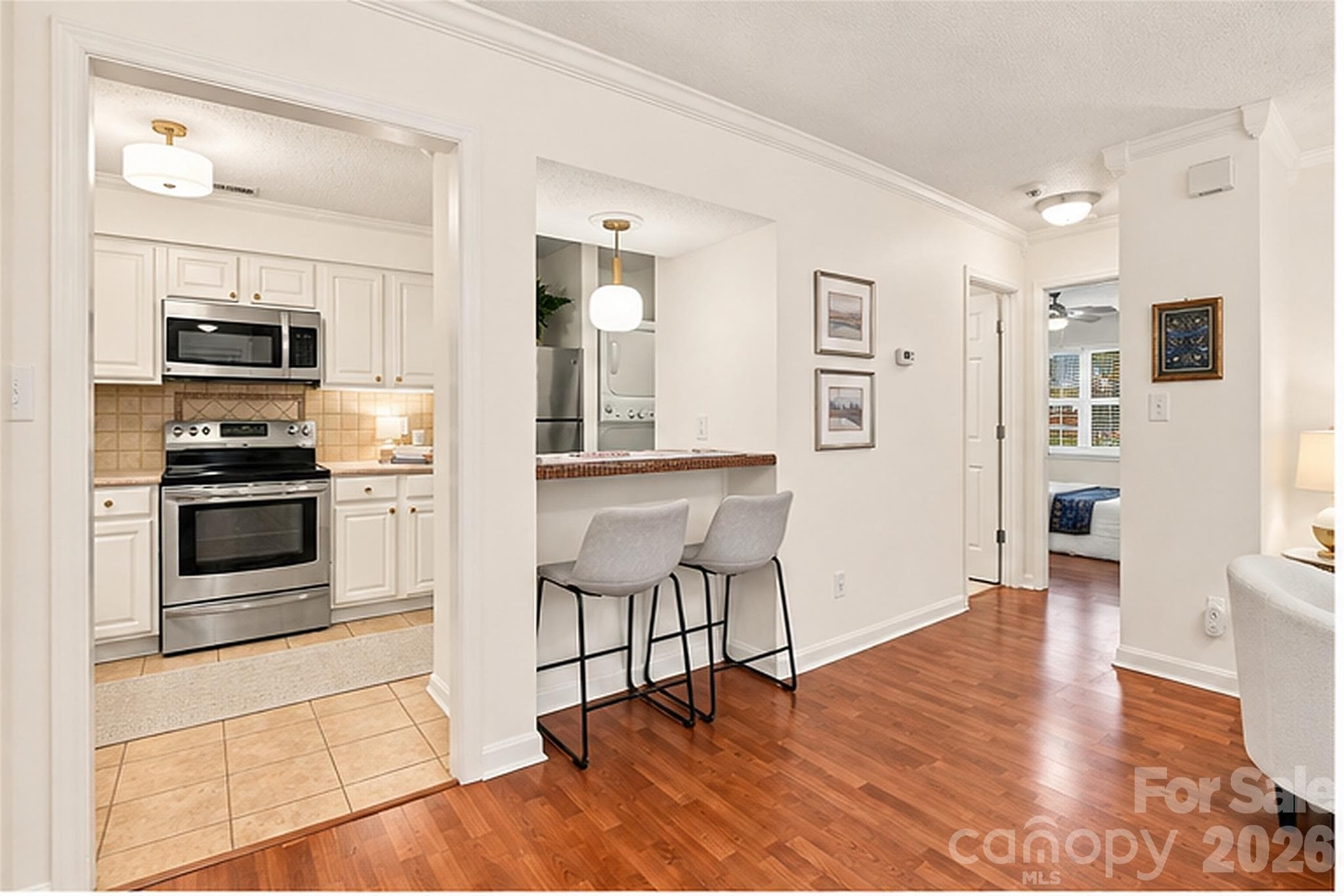 Breakfast bar with new light fixture - 1051 Churchill Downs Court, Charlotte