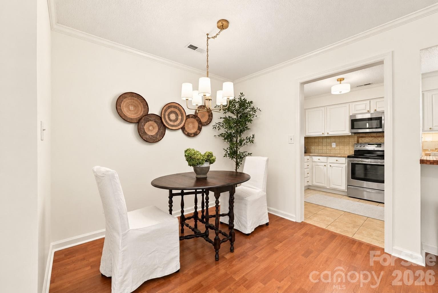 Dining area with new light fixture - 1051 Churchill Downs Court, Charlotte
