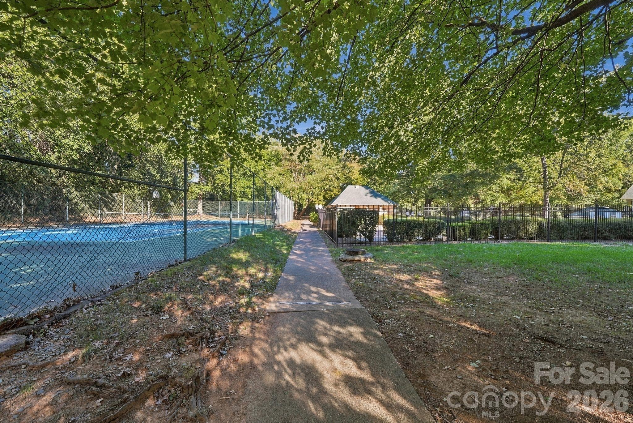 Community clubhouse tennis courts, club house, and pool walkable from condo - 1051 Churchill Downs Court, Charlotte