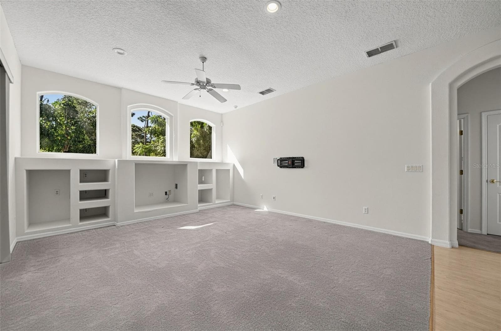FAMILY ROOM HAS 3 ARCHED WINDOWS /Users/gemmehouse/Desktop/13838 RIVERPATH/259768-online-13838-riverpath-grove-dr-orlando-fl-32826-usa/LAUNDRY ROOM.jpgTHAT BRIGHTEN UP THE SPACE. - 13838 RIVERPATH GROVE DR, ORLANDO