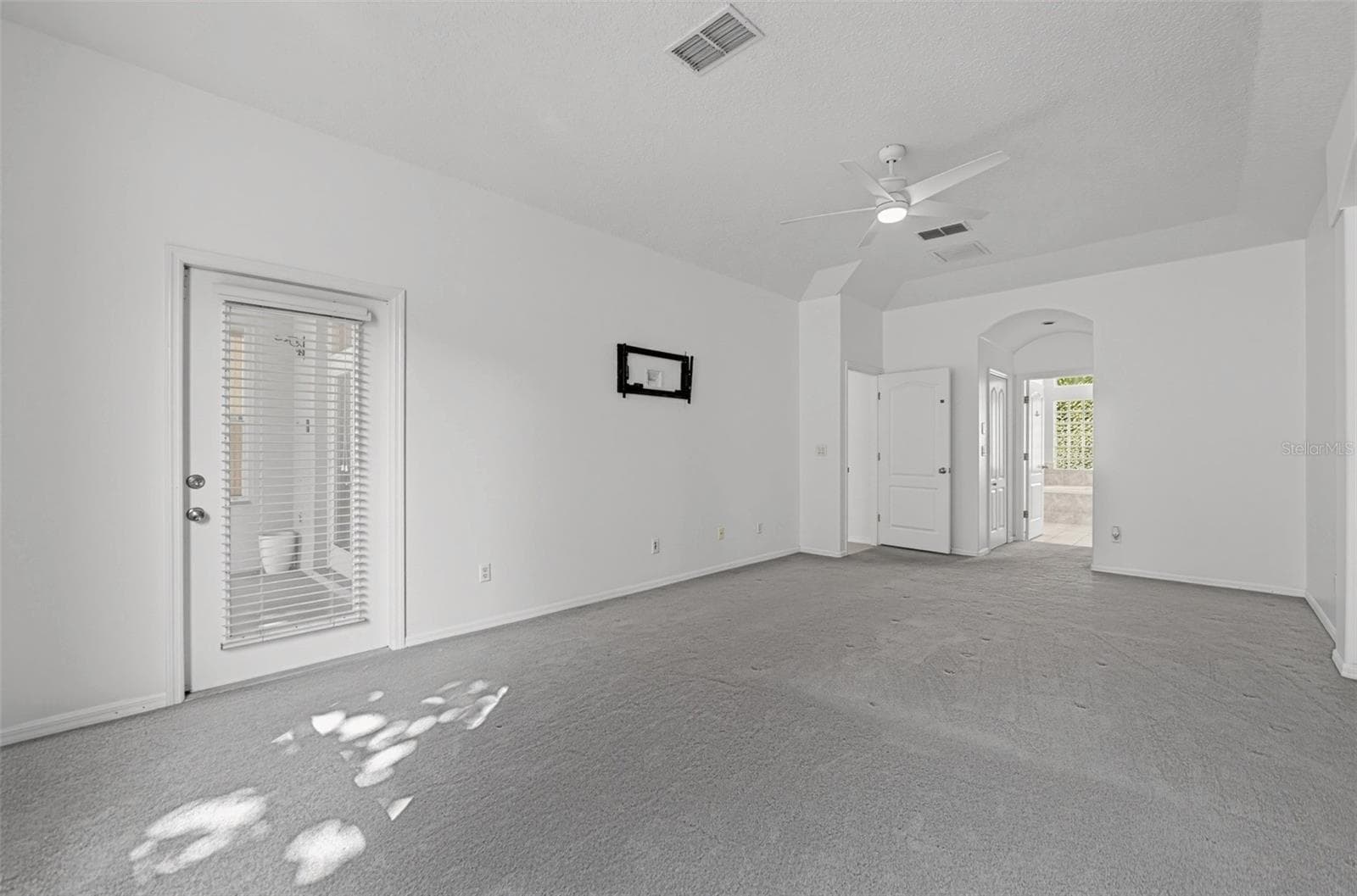 PRIMARY BEDROOM WITH LANAI ACCESS - 13838 RIVERPATH GROVE DR, ORLANDO