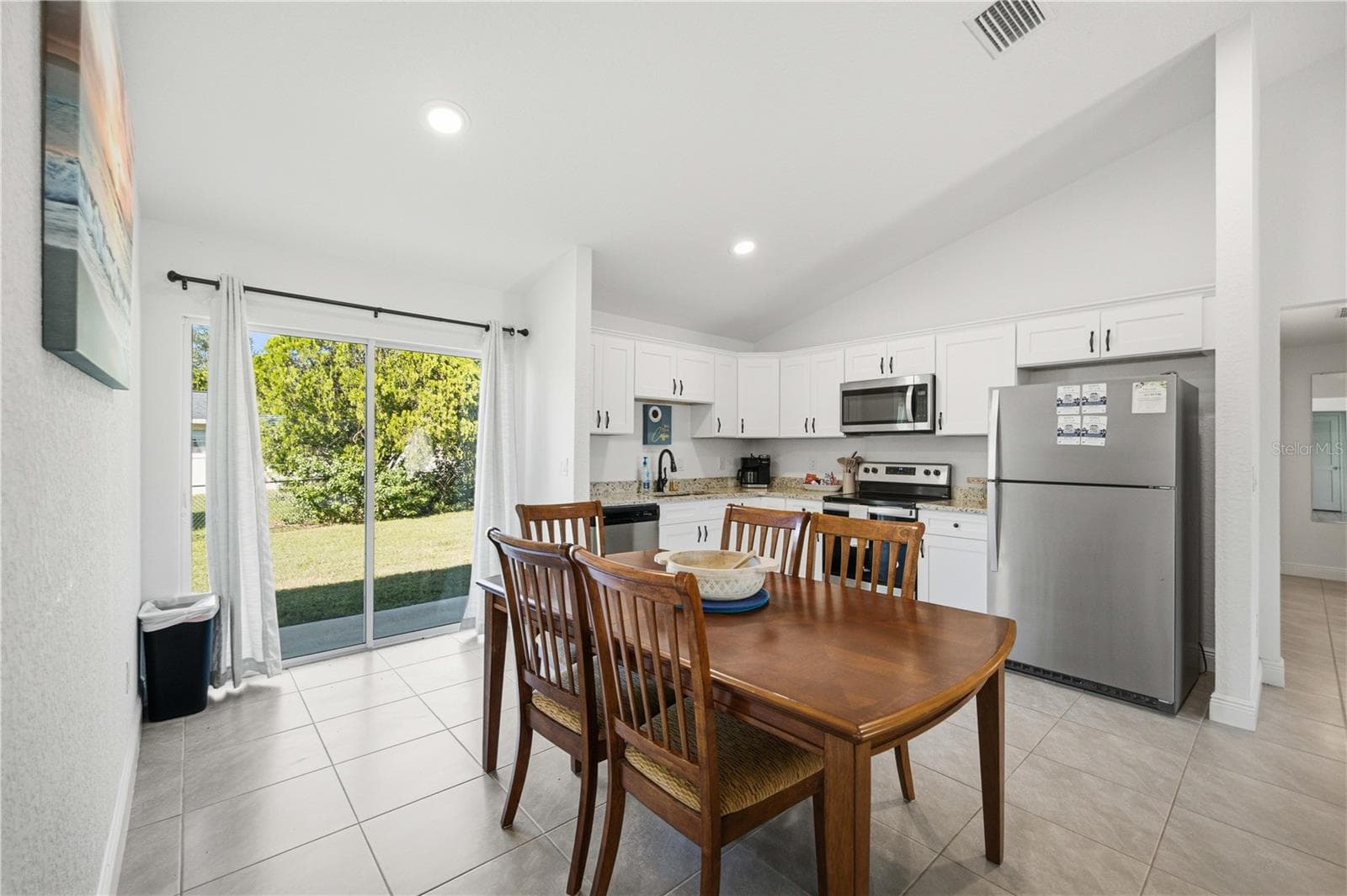 L - Shaped Kitchen with Sliders to the Backyard - 5591 W HIGHWAY 40, OCALA