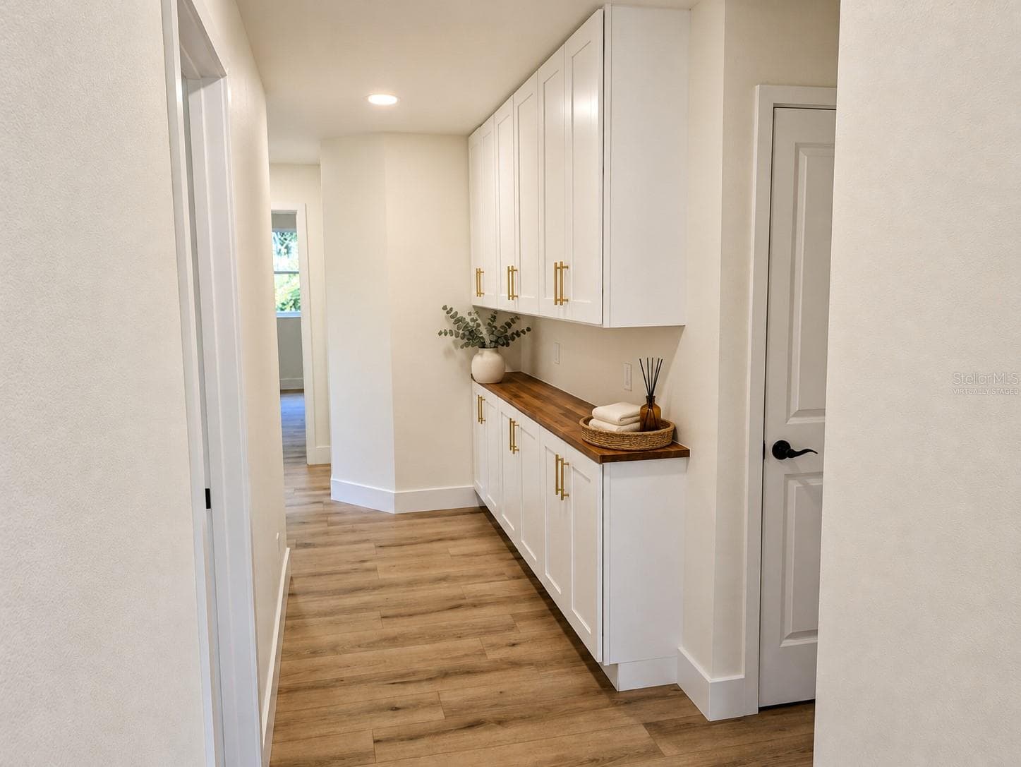 breakfast bar/ storage cabinetry Virtually staged - 2748 GLENWOOD AVE, NEW SMYRNA BEACH