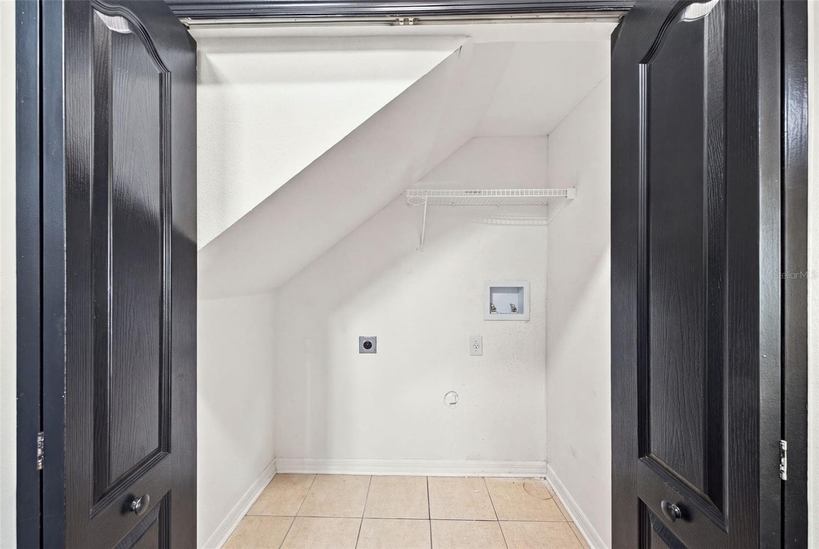 Laundry closet-downstairs - 30316 ELDERWOOD DR, WESLEY CHAPEL