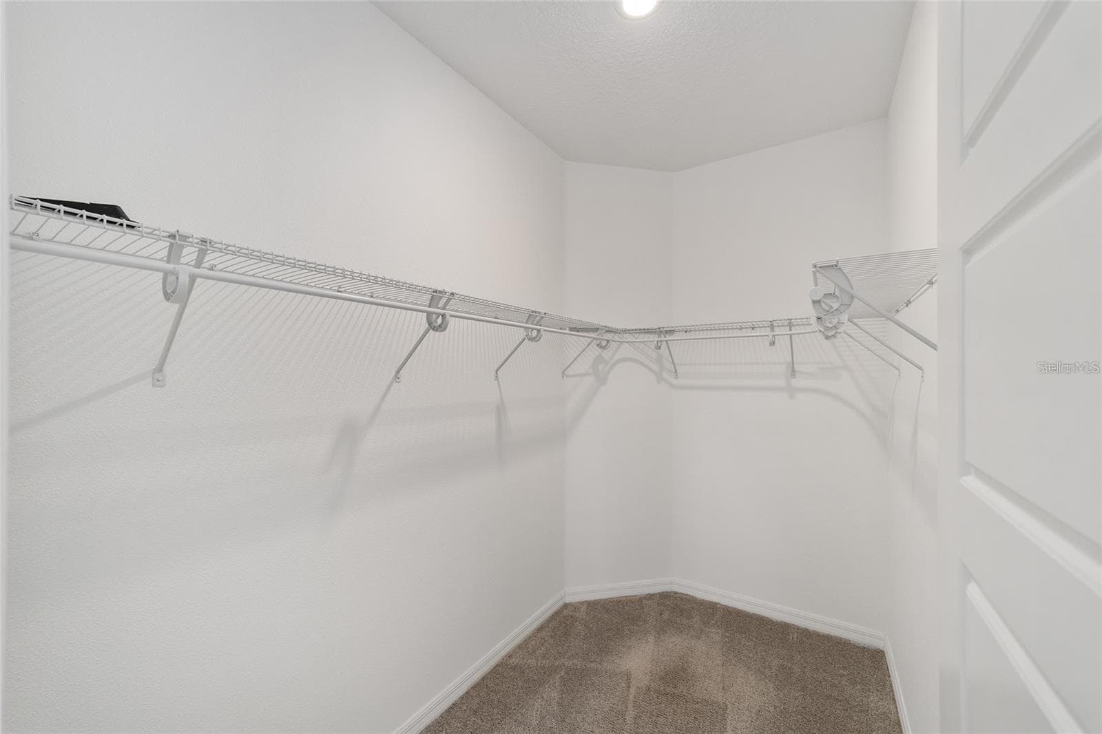 Primary Bedroom Walk-in Closet - 9979 SW 88TH LOOP, OCALA