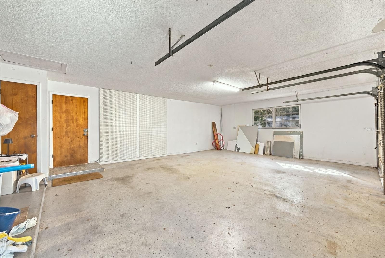 Interior of oversized attached 2 car garage - 19709 HIAWATHA RD, ODESSA