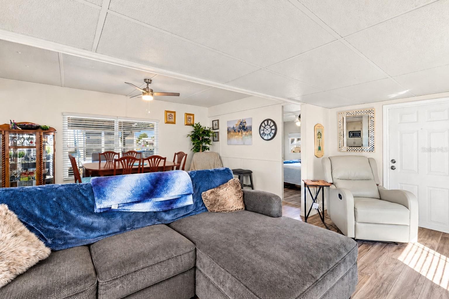 Open concept dining and living room. - 37332 SANDRA AVE, ZEPHYRHILLS