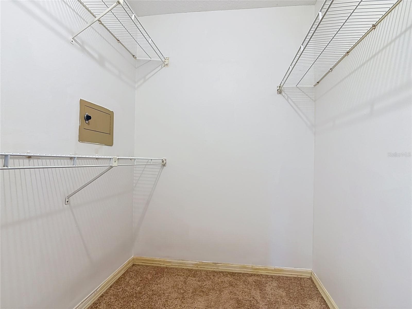 Primary Closet 1 - 510 BROKENSHIRE DR, DEBARY
