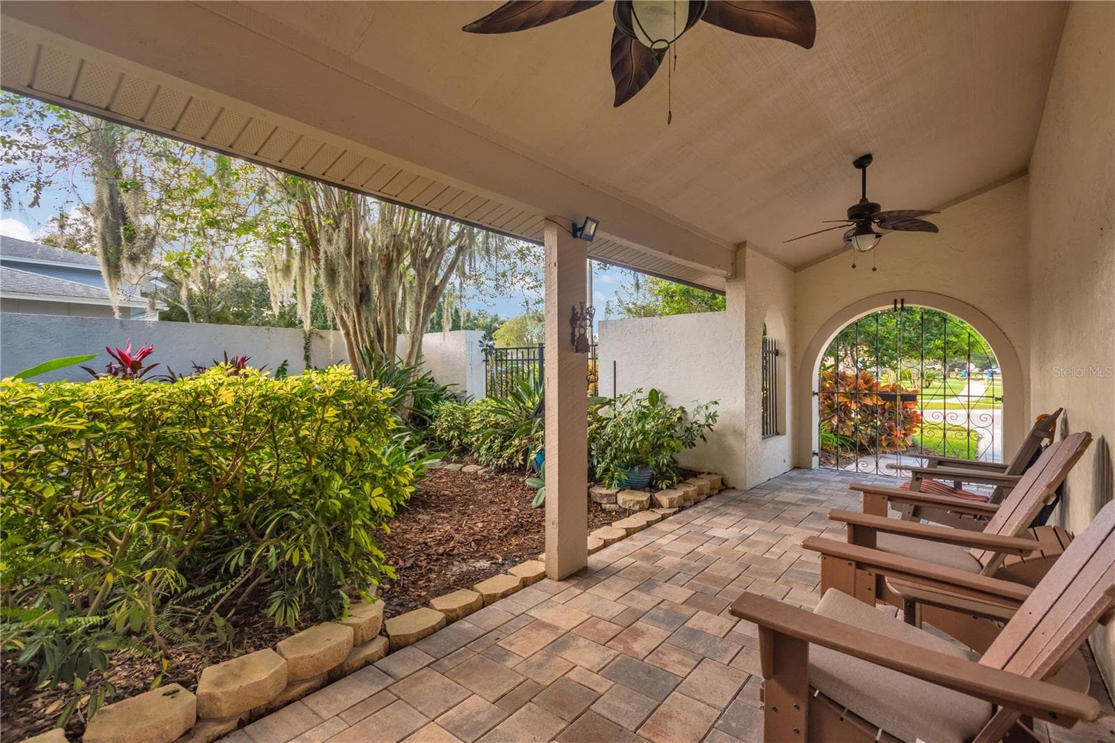Courtyard entrance w/ decorative gate - 16407 W COURSE DR, TAMPA