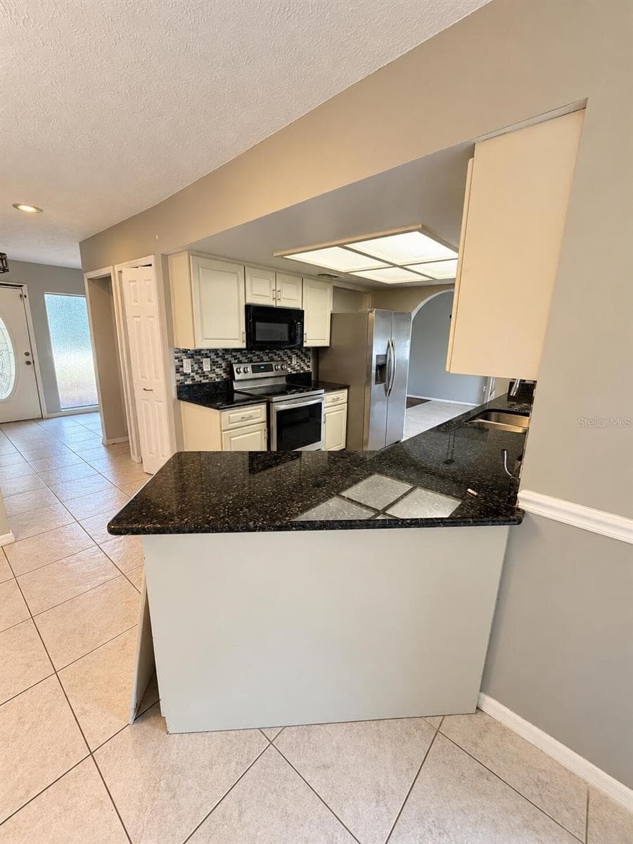 Single Family Residence at 423 WATERSIDE ST, PORT CHARLOTTE, photo 8 of 17