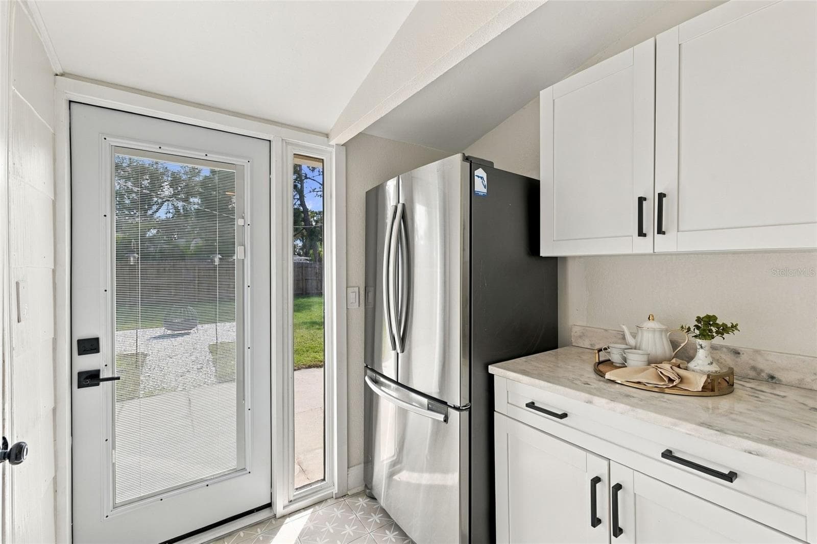 Kitchen / View of Back Door - 1548 CANTERBURY RD N, ST PETERSBURG