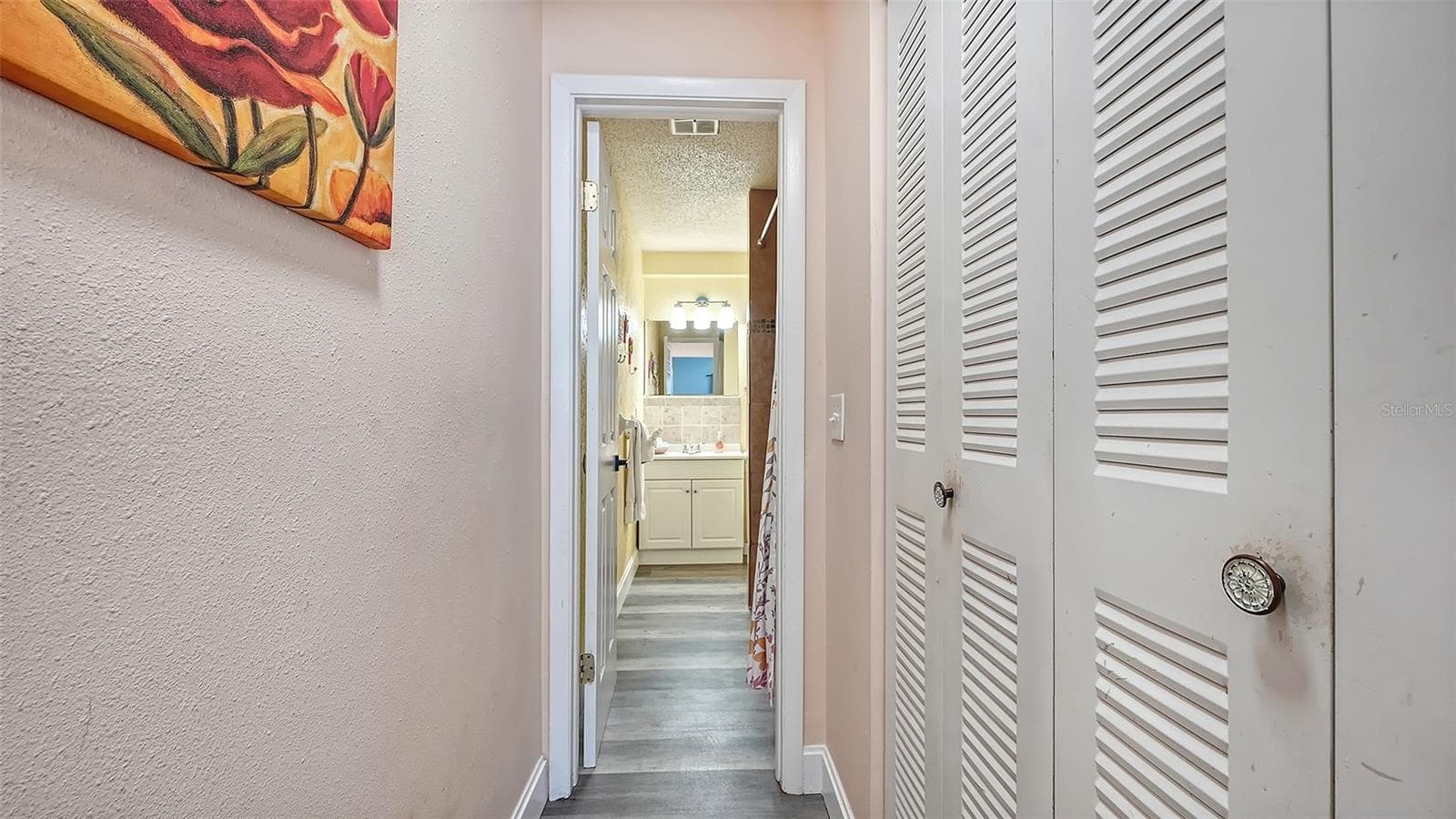 Unit B, hallway from bedroom to bathroom. - 2514 AVENUE B, BRADENTON BEACH