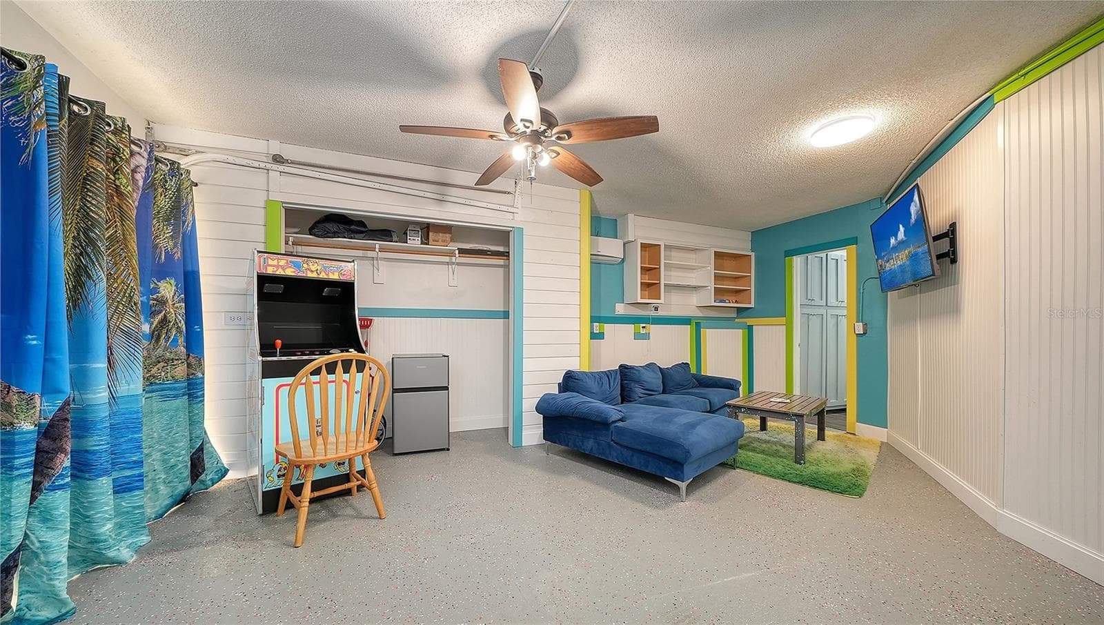 Ground floor under Unit B, converted garage to game or rec room/storage space. - 2514 AVENUE B, BRADENTON BEACH