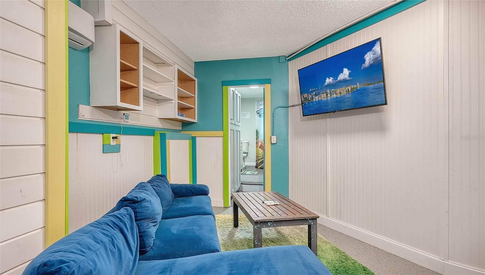 Ground floor under Unit B, converted garage to game or rec room/storage space. - 2514 AVENUE B, BRADENTON BEACH