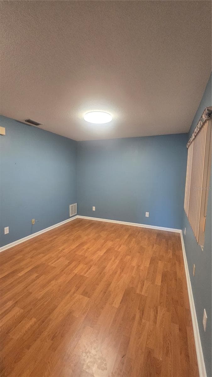 Living area of the mother in law suite or make it an amazing master bedroom suite or use it as a second bonus room (office, gym, playroom, craft room, music room, theatre, etc) - 10386 112TH WAY N, SEMINOLE
