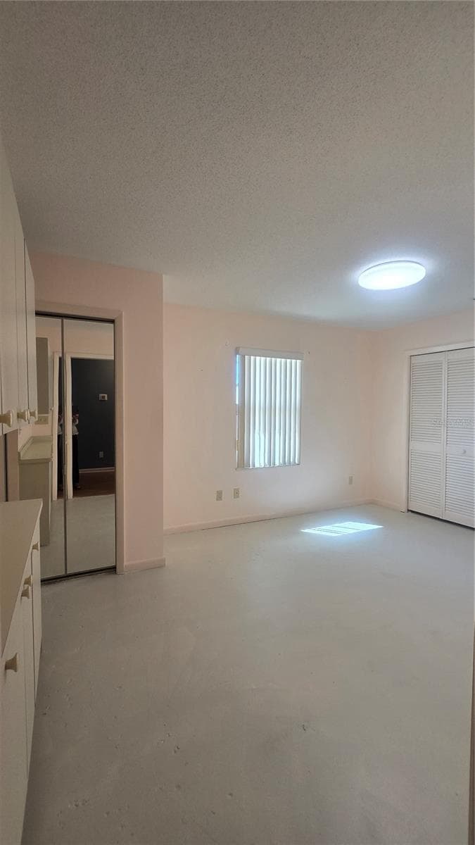 2nd room of the mother in law suite features two closets and built in cabinetry - 10386 112TH WAY N, SEMINOLE