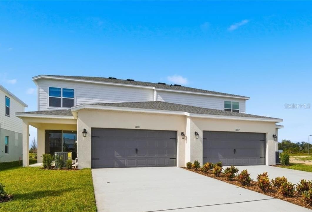 Rear/Garage Entry (right Side) - 10717 WADING RIVER AVE, PARRISH