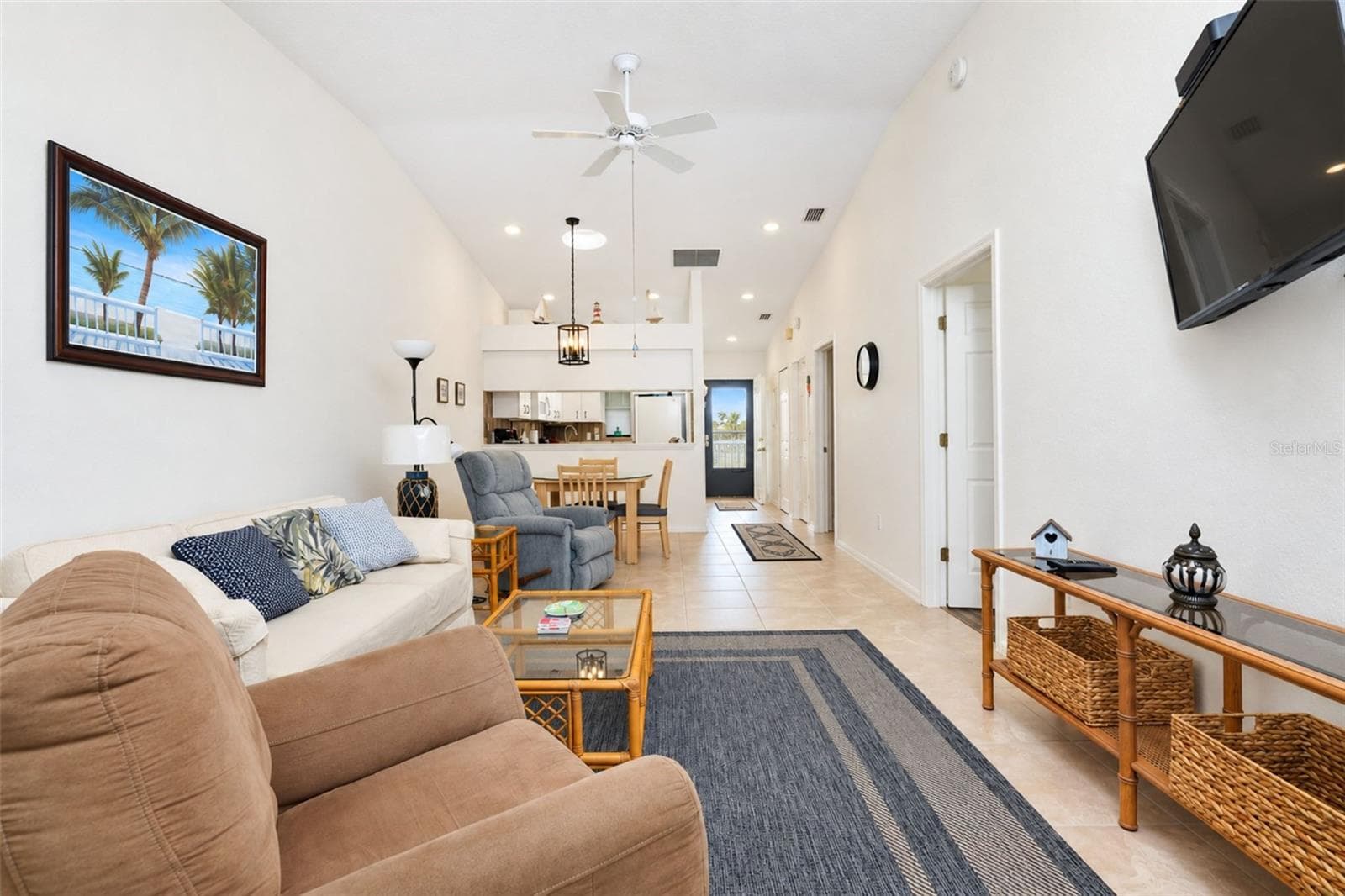 The view into the living & dining area from the lanai. - 4260 PLACIDA RD #9C, ENGLEWOOD