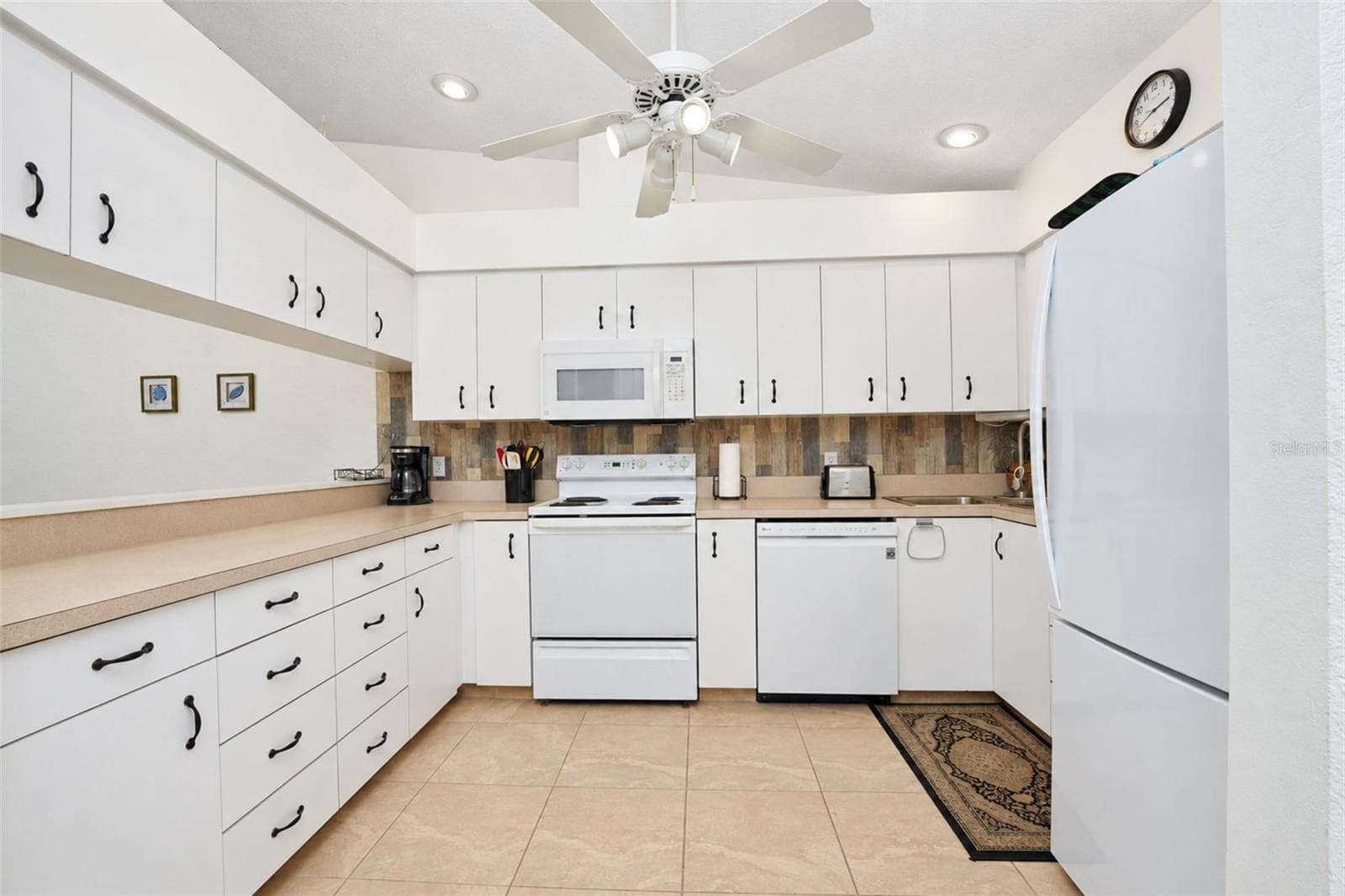 The appliances include a Kenmore Elite refrigerator, Kenmore microwave, GE stove and LG dishwasher. - 4260 PLACIDA RD #9C, ENGLEWOOD